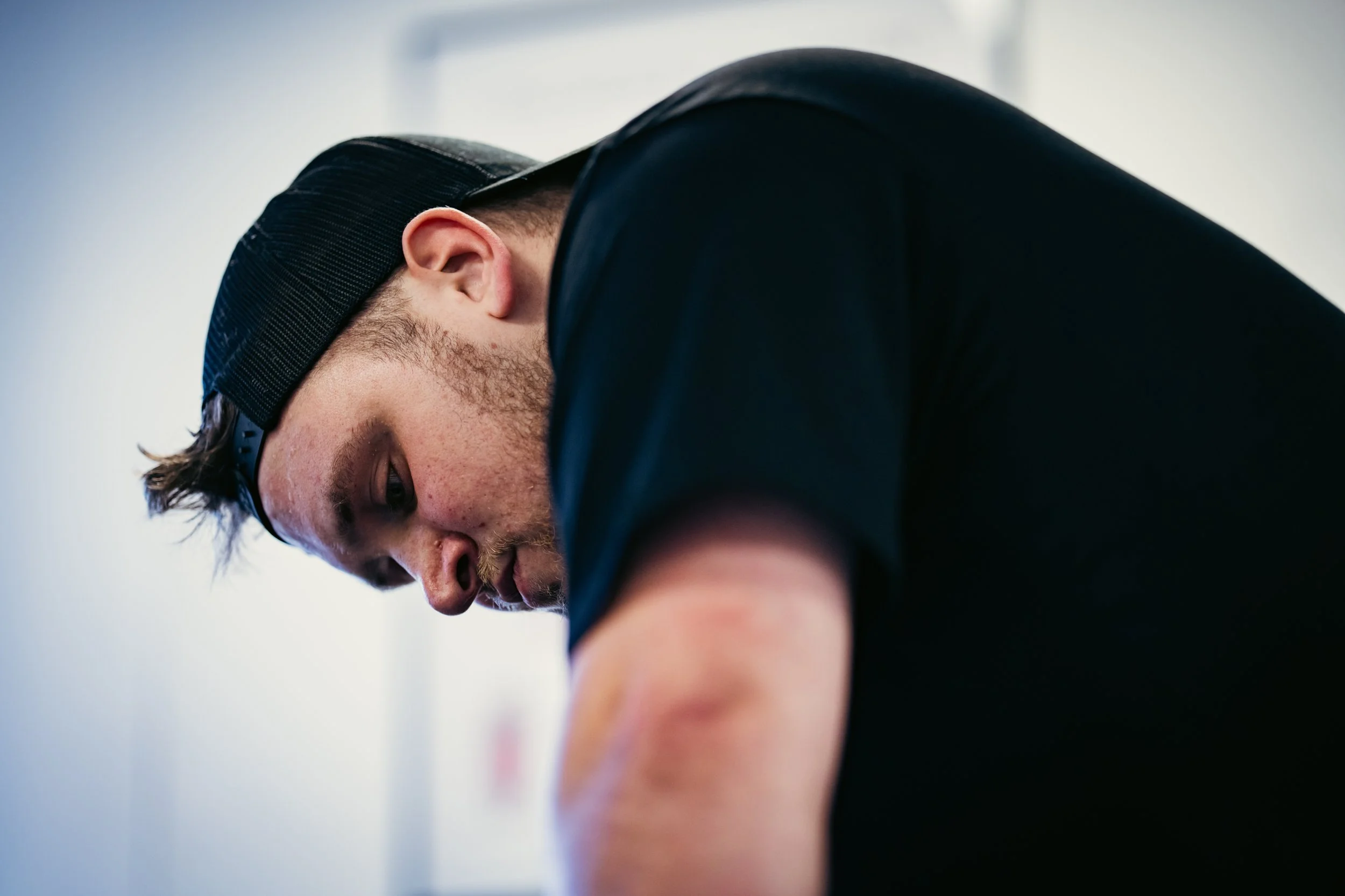 Sports therapist assessing a client’s shoulder and upper  limb during a hands on treatment session at Training and Treatment sports therapy clinic in Winchester.