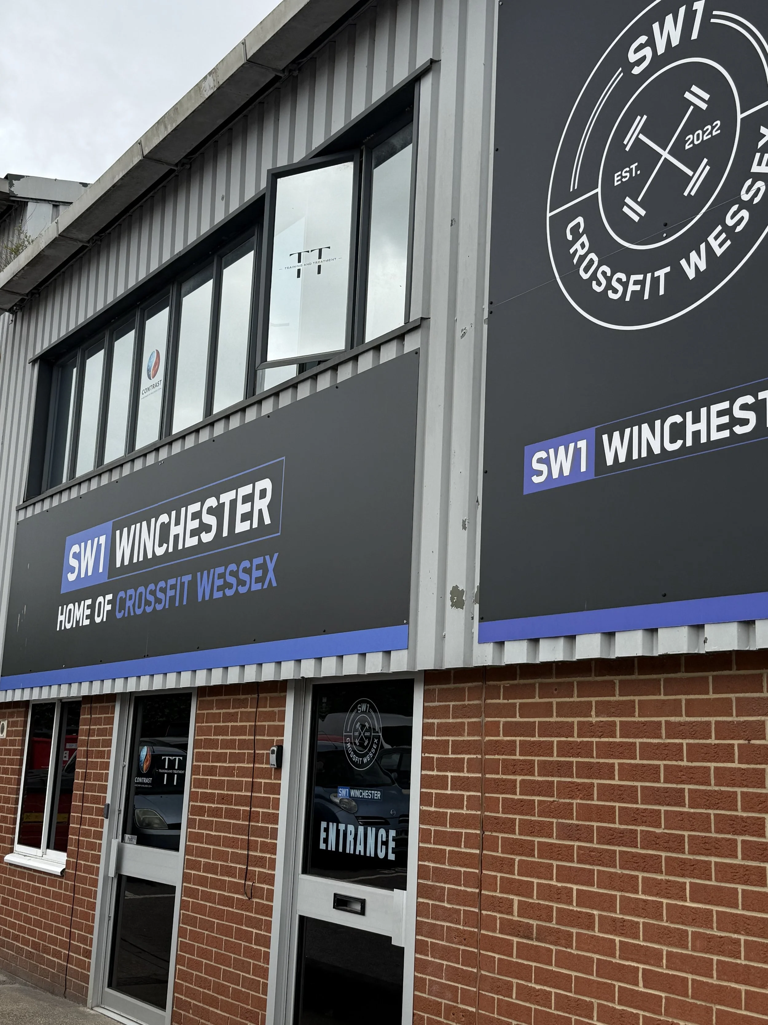 Training and Treatment sports therapy clinic located above CrossFit Wessex in Winnall, Winchester, with clinic logo displayed