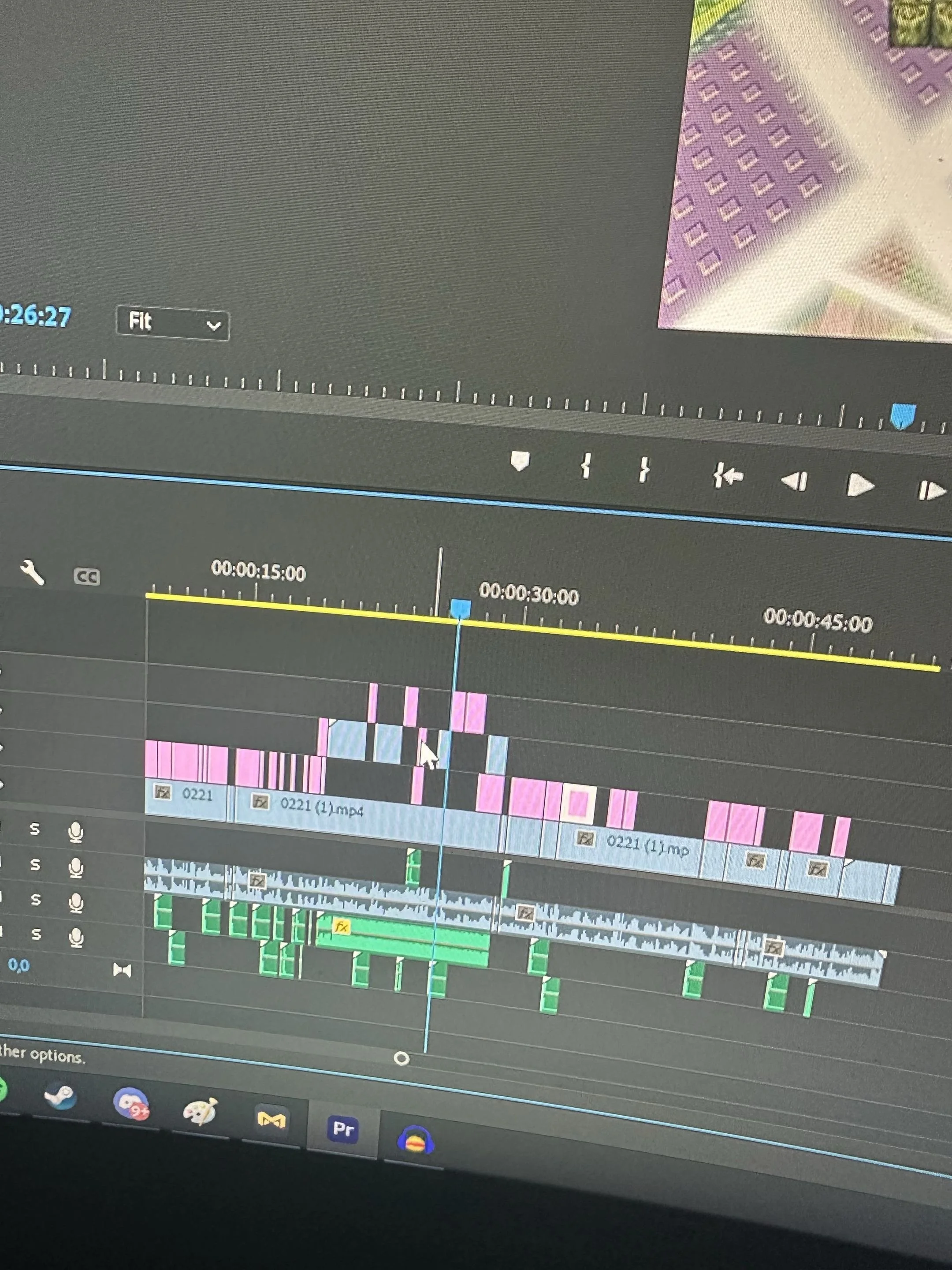 Screenshot of a video editing software timeline with multiple video and audio tracks, showing various clips, transitions, and editing tools.