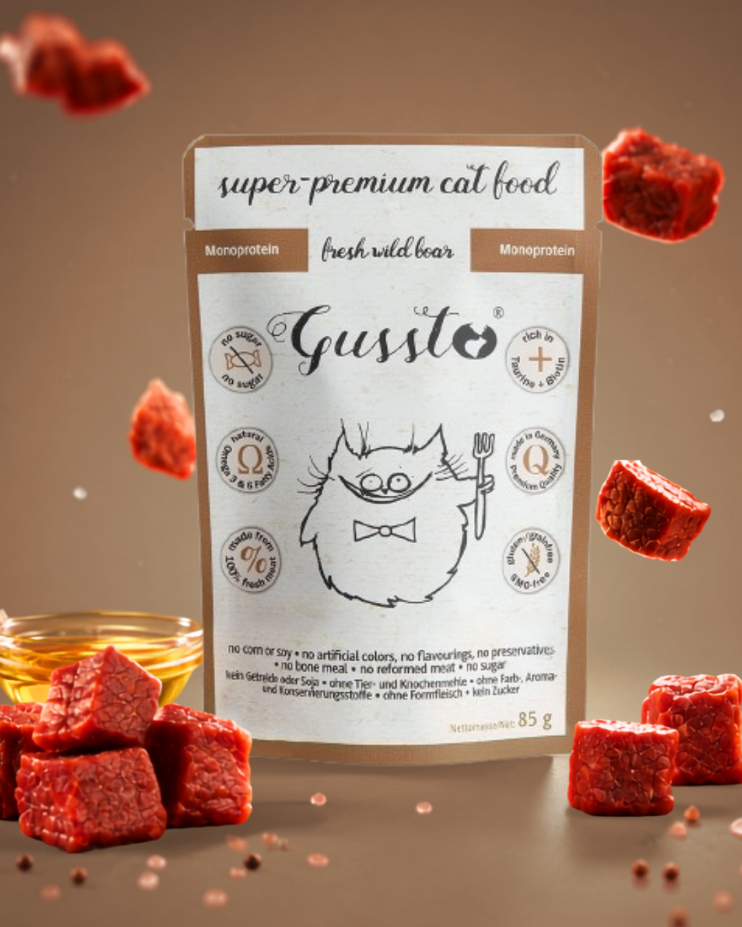 Package of cat food labeled 'super-premium cat food' with a cute cartoon cat illustration holding a fork. Surrounding the package are pieces of raw red meat and a small bowl of oil.