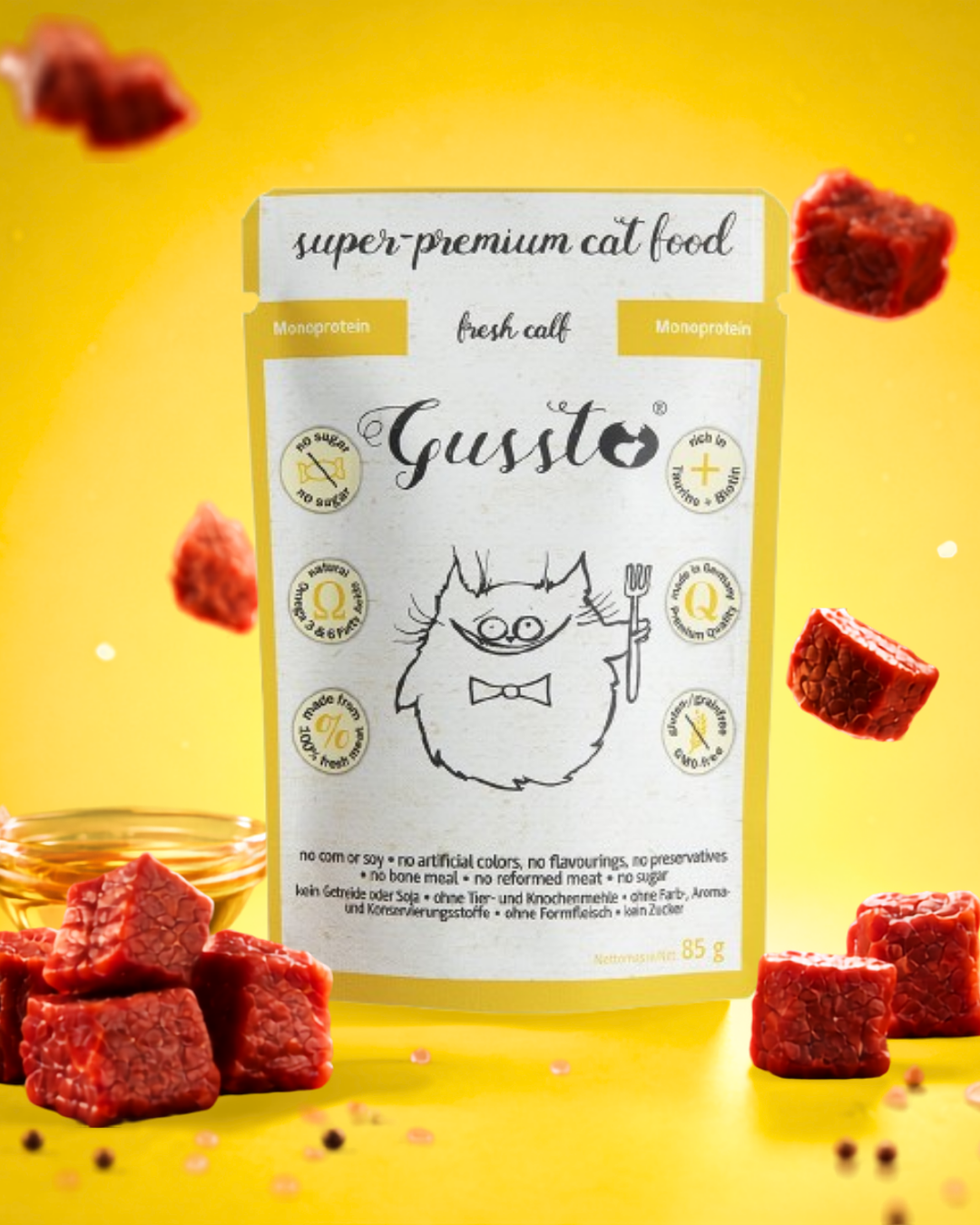 A package of super-premium cat food labeled 'Gusto' is placed against a yellow background, surrounded by red, cube-shaped pet treats and a small bowl of liquid.