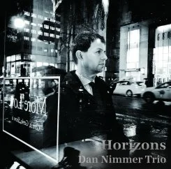 Album cover of Horizons by the Dan Nimmer Trio, featuring pianist Dan Nimmer seated at a grand piano.