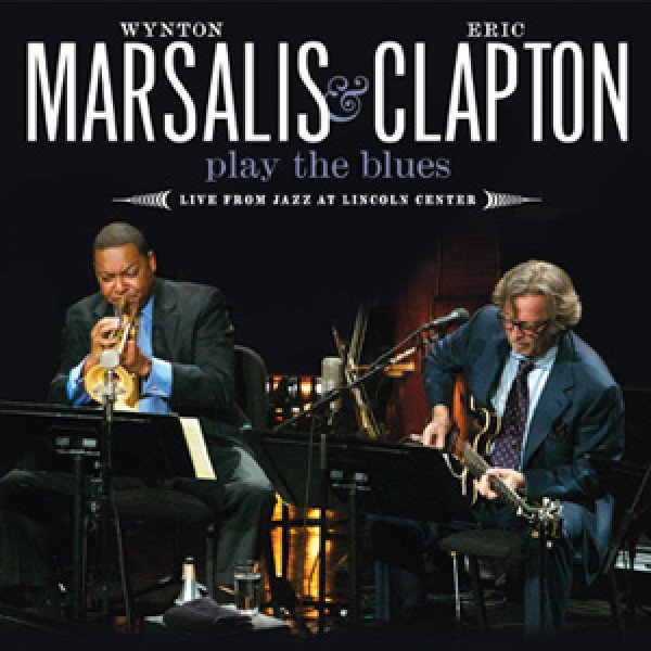 Album cover of Play the Blues: Live from Jazz at Lincoln Center by Wynton Marsalis and Eric Clapton, featuring Wynton Marsalis and Eric Clapton performing on the stage together.