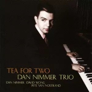 Album cover of Tea for Two by the Dan Nimmer Trio, featuring pianist Dan Nimmer seated beside a grand piano.