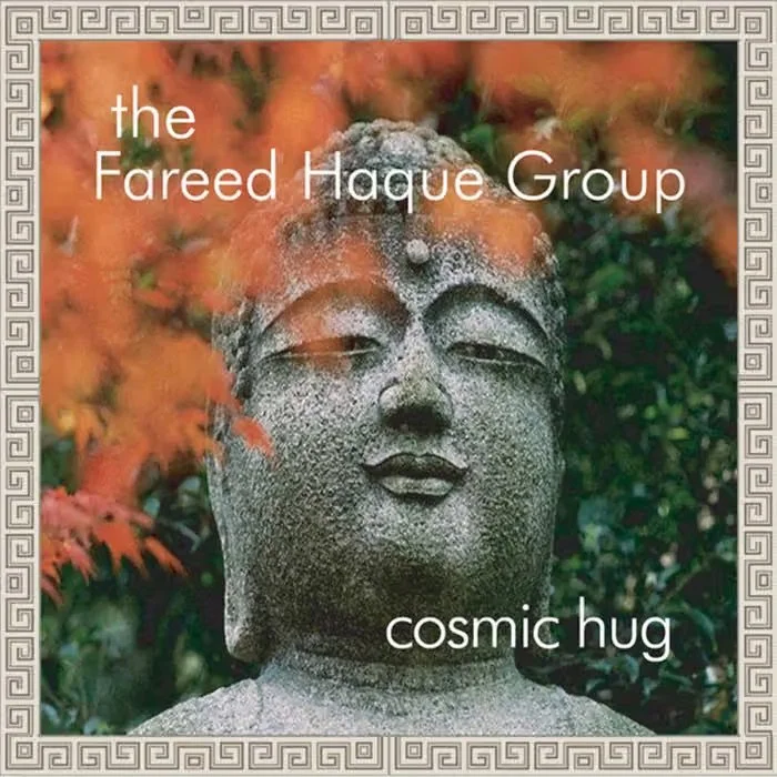 Album cover of Cosmic Hug by the Fareed Haque Group, featuring a stone Buddha statue surrounded by orange and green foliage.
