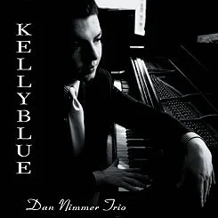 Kelly Blue album cover by the Dan Nimmer Trio, featuring jazz pianist Dan Nimmer seated beside a grand piano.
