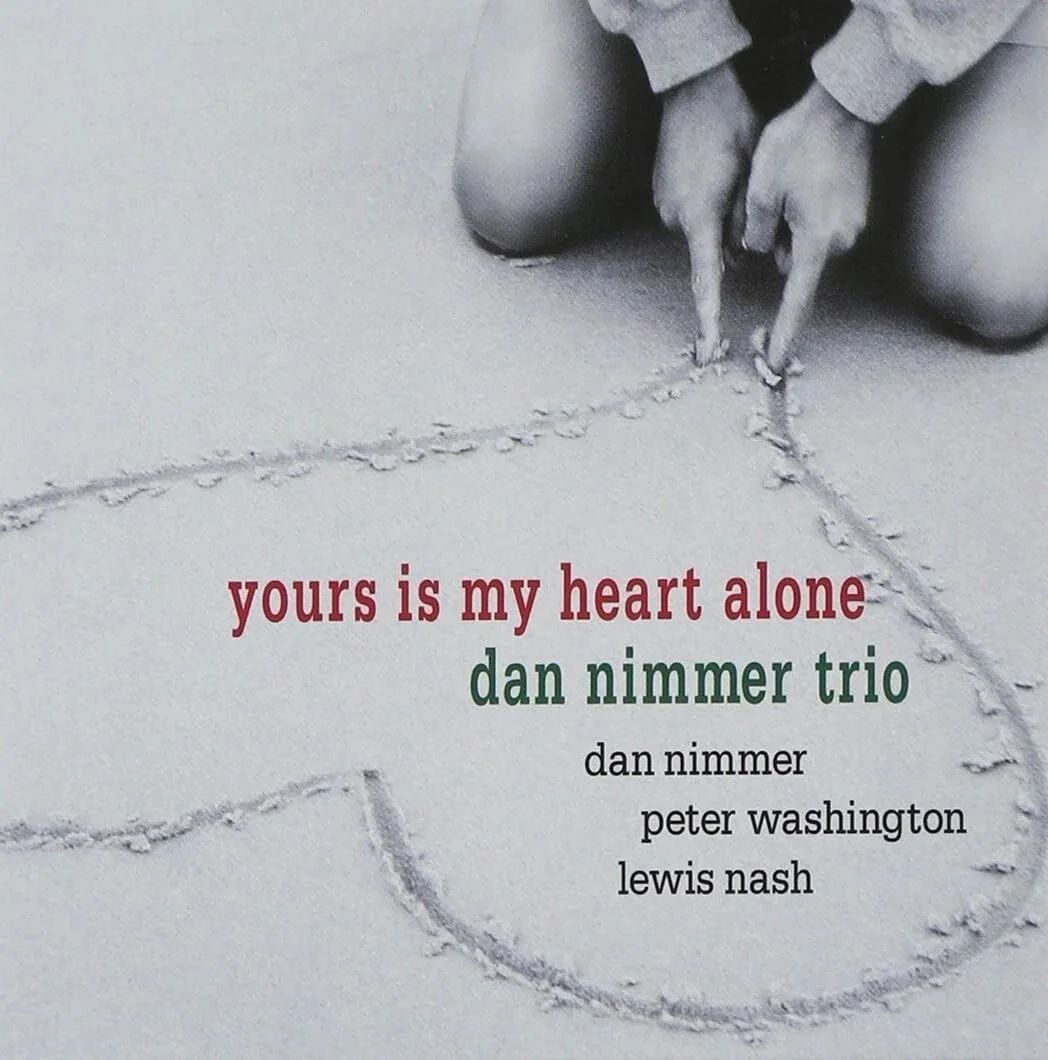 Album cover of Yours Is My Heart Alone by the Dan Nimmer Trio, featuring hands forming a heart shape against a beach background.