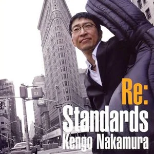 Album cover of Re:Standards by Kengo Nakamura, featuring bassist Kengo Nakamura standing on a New York City street.