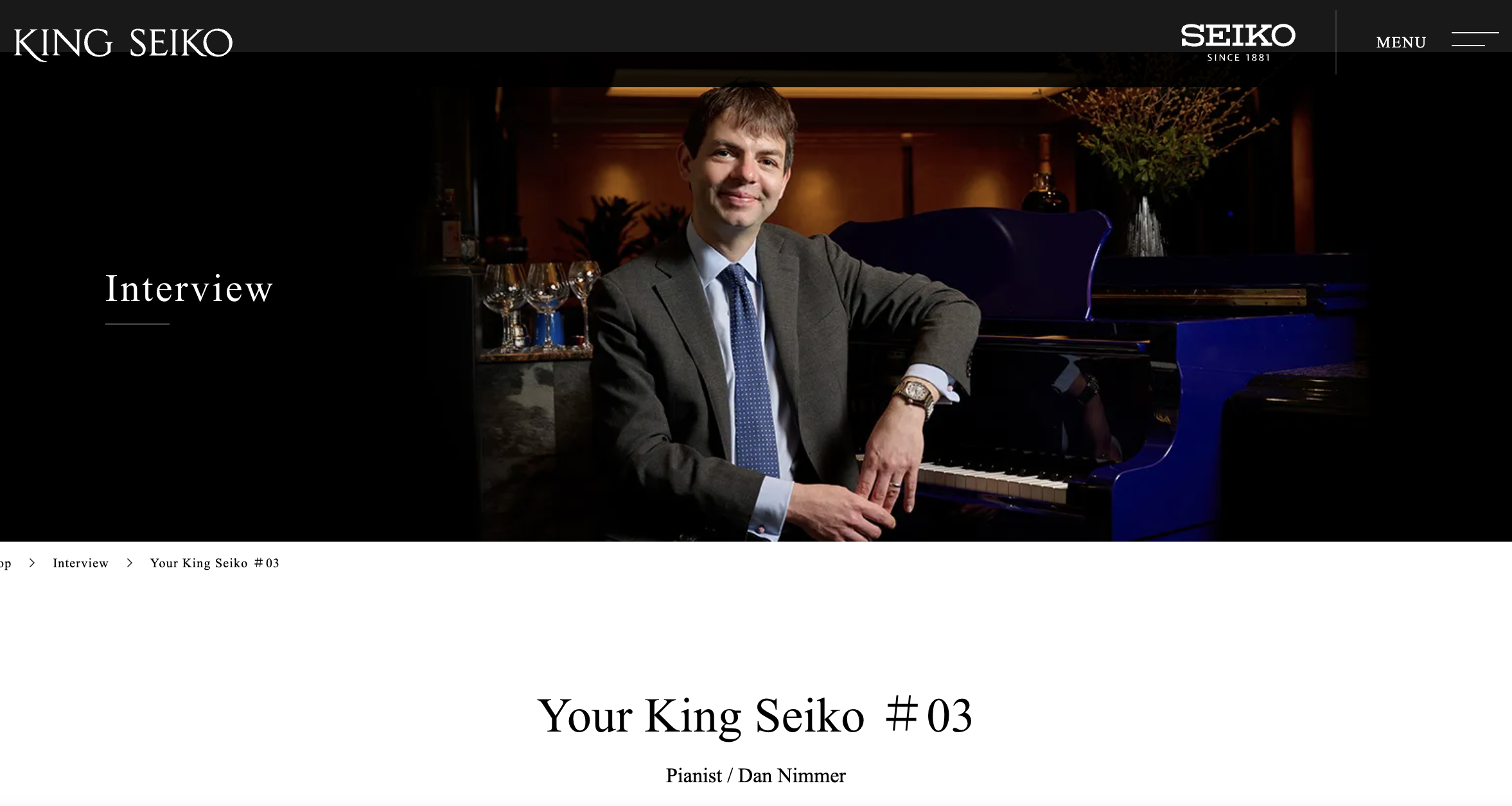 Jazz pianist Dan Nimmer seated beside a grand piano wearing a King Seiko watch for a KING SEIKO interview.