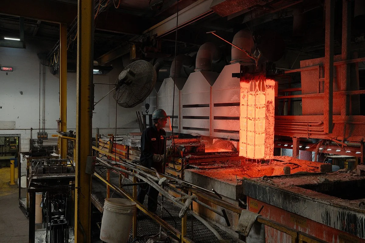 Centurion Metalworks employee monitoring heated metal during thermal processing