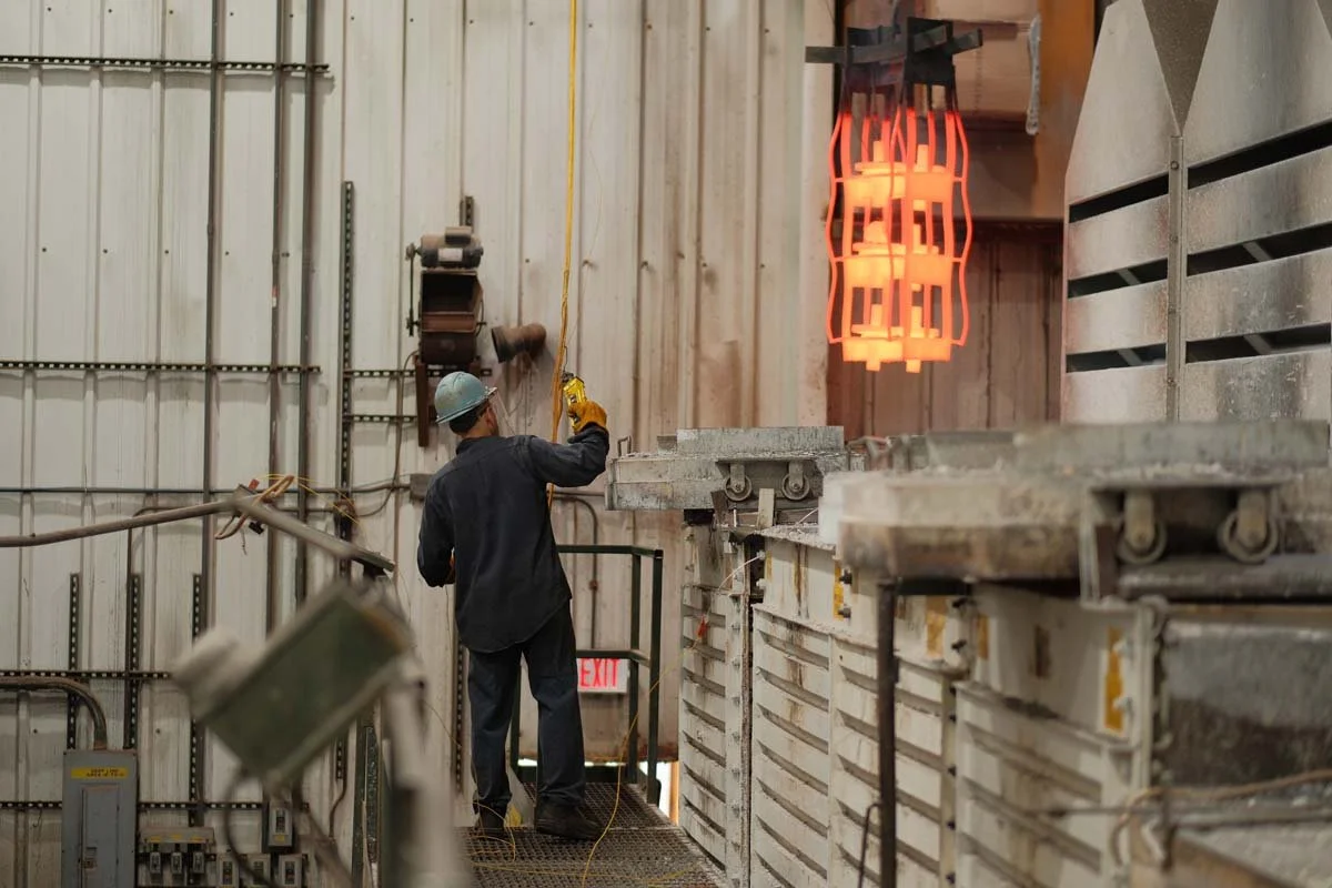 Centurion Metalworks employee working near a heat-treat furnace