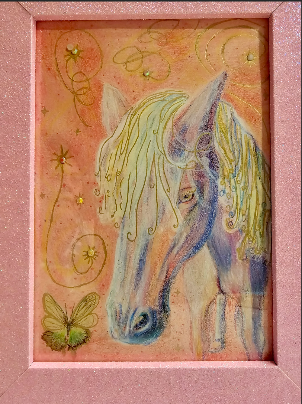A colored pencil drawing of a horse and butterfly inside a glittery pink frame