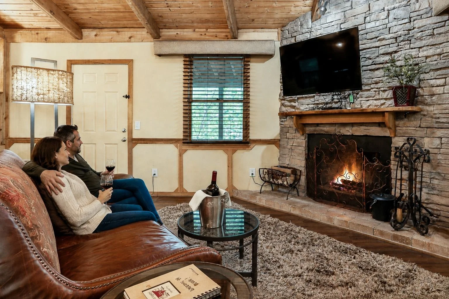 Enjoy a glass of local wine by the fireplace