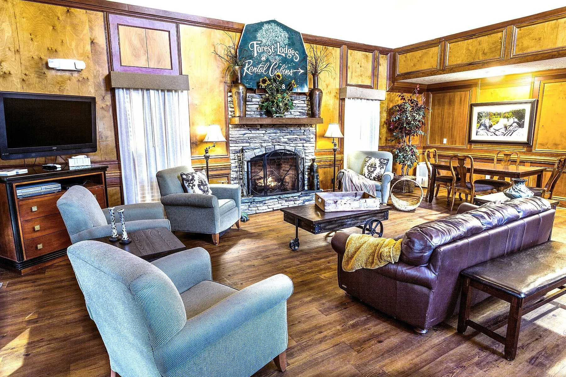 Treetopper Lodge private hospitality room with fireplace and group seating