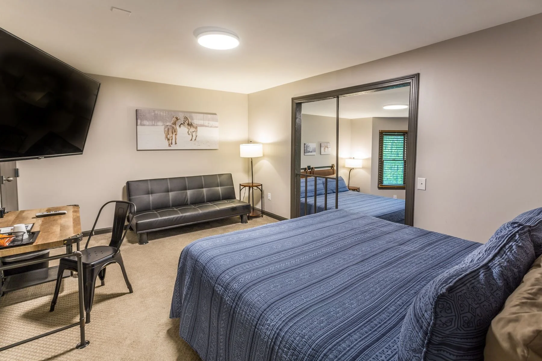 Updated lodge room layout featuring two plush king beds in a pet-free building.