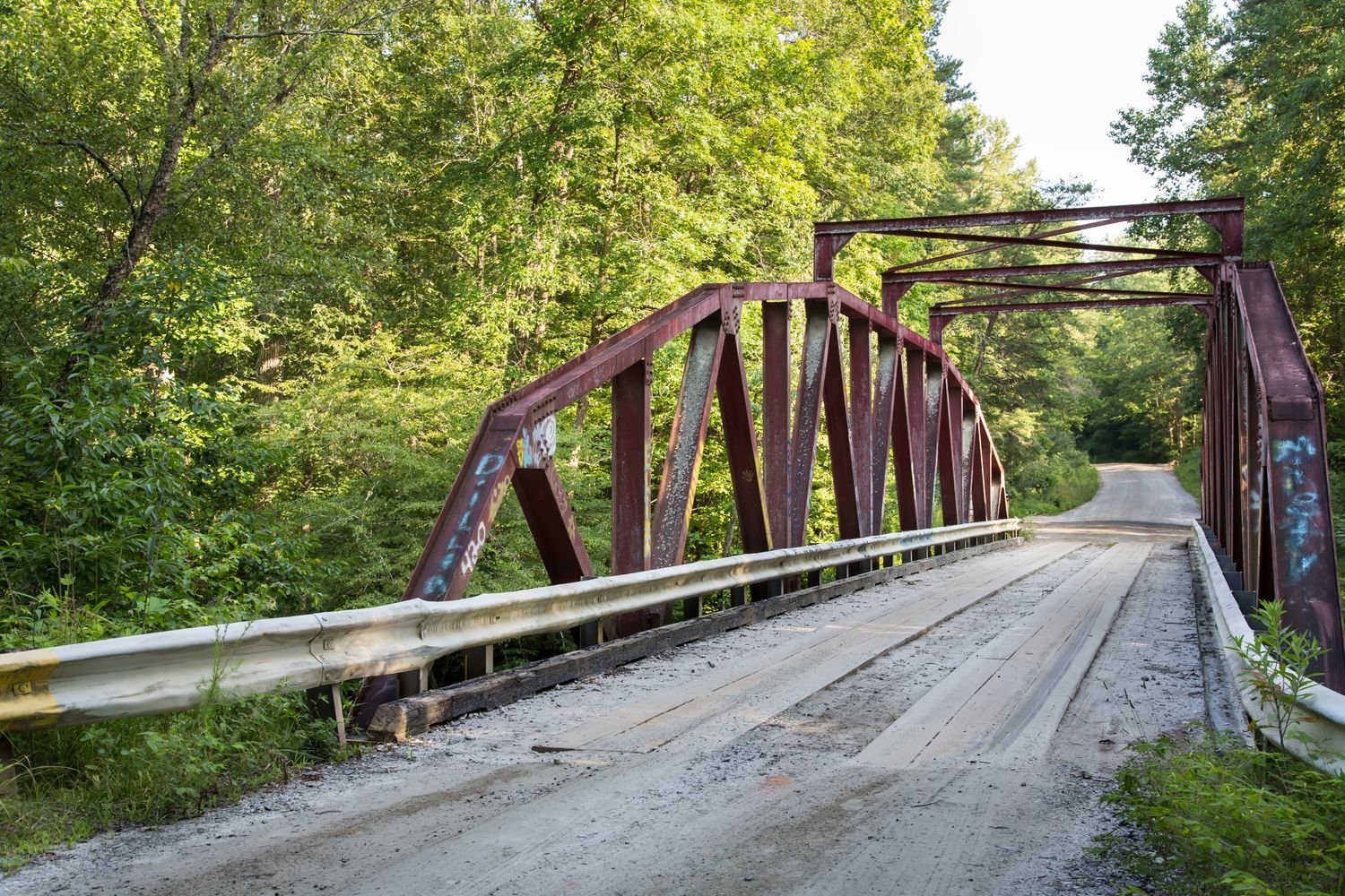 Steel bridge at Devil's Elbow -a scenic and popular swimming, tubing, and trout-fishing spot located along the upper section of Amicalola Creek within the Dawson Wildlife Management Area.