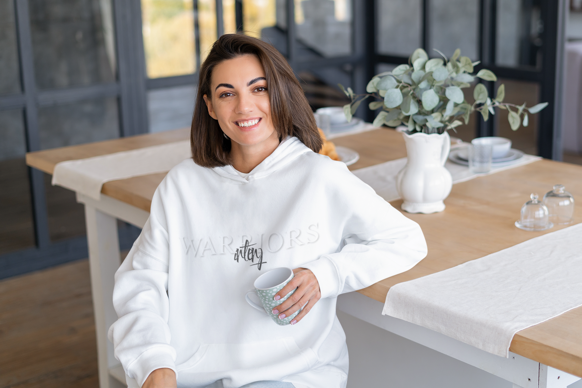 hoodie-mockup-featuring-a-happy-woman-sitting-in-her-dining-room-m19089-r-el2.png