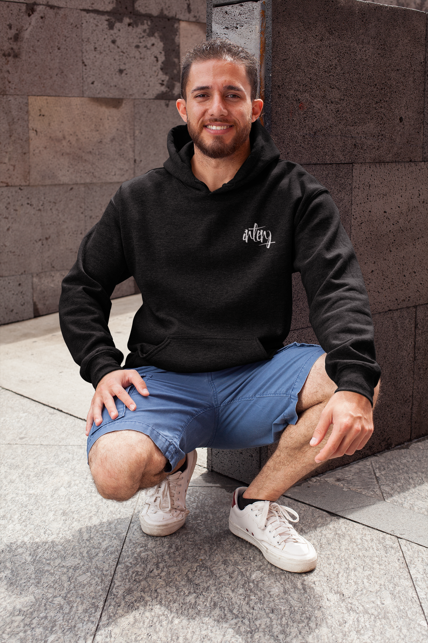 heathered-hoodie-pullover-mockup-featuring-a-smiling-man-in-a-crouching-position-28629.png