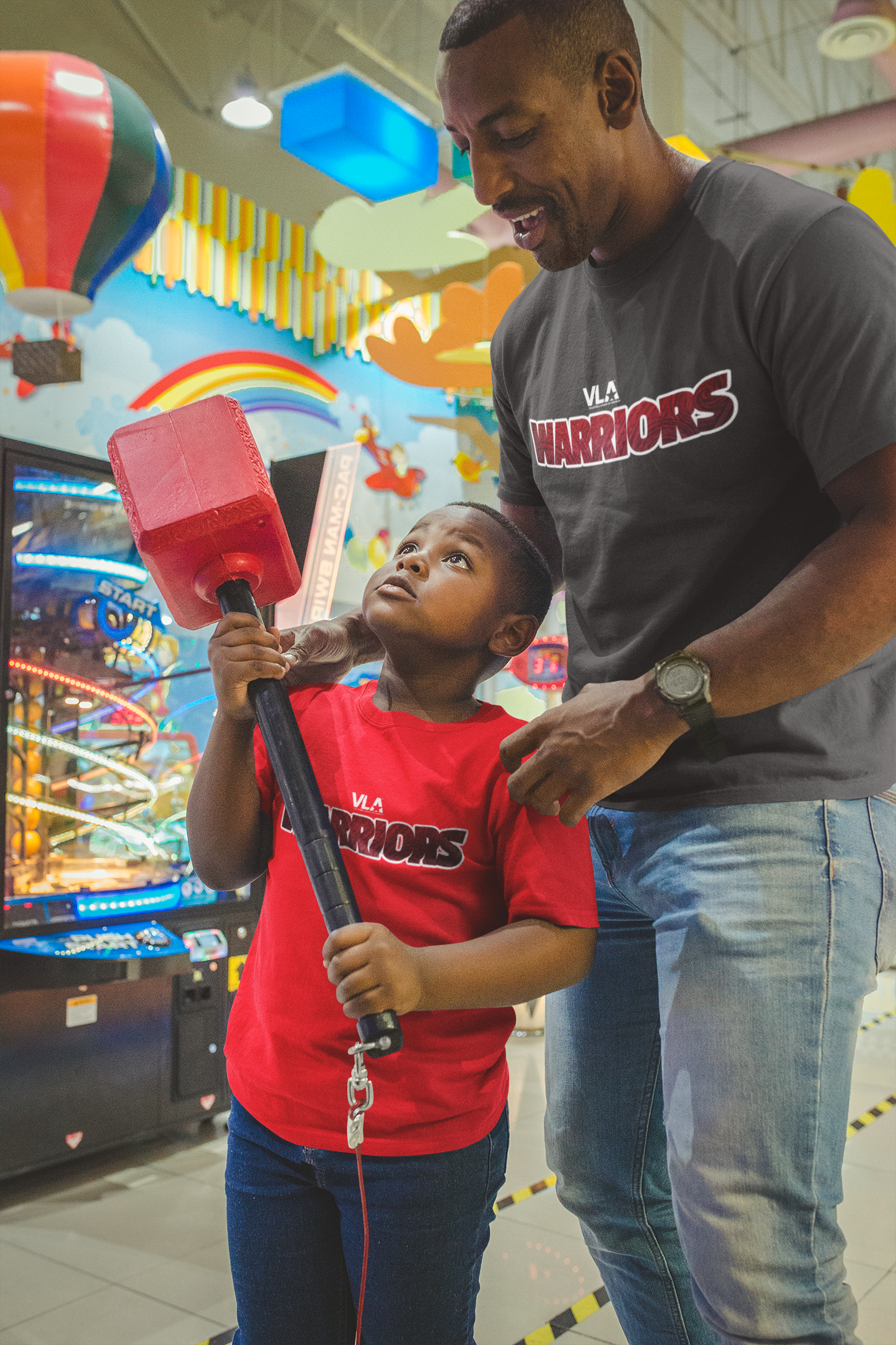 mockup-of-a-father-and-son-wearing-t-shirts-near-the-high-striker-a20546.png