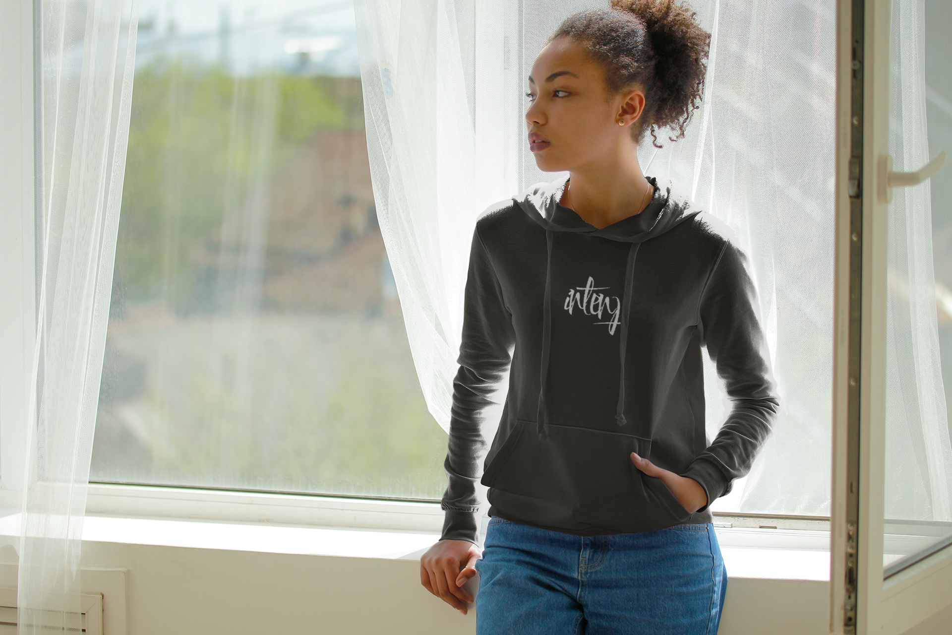 hoodie-mockup-of-a-serious-woman-posing-by-a-window-5325-el1.png