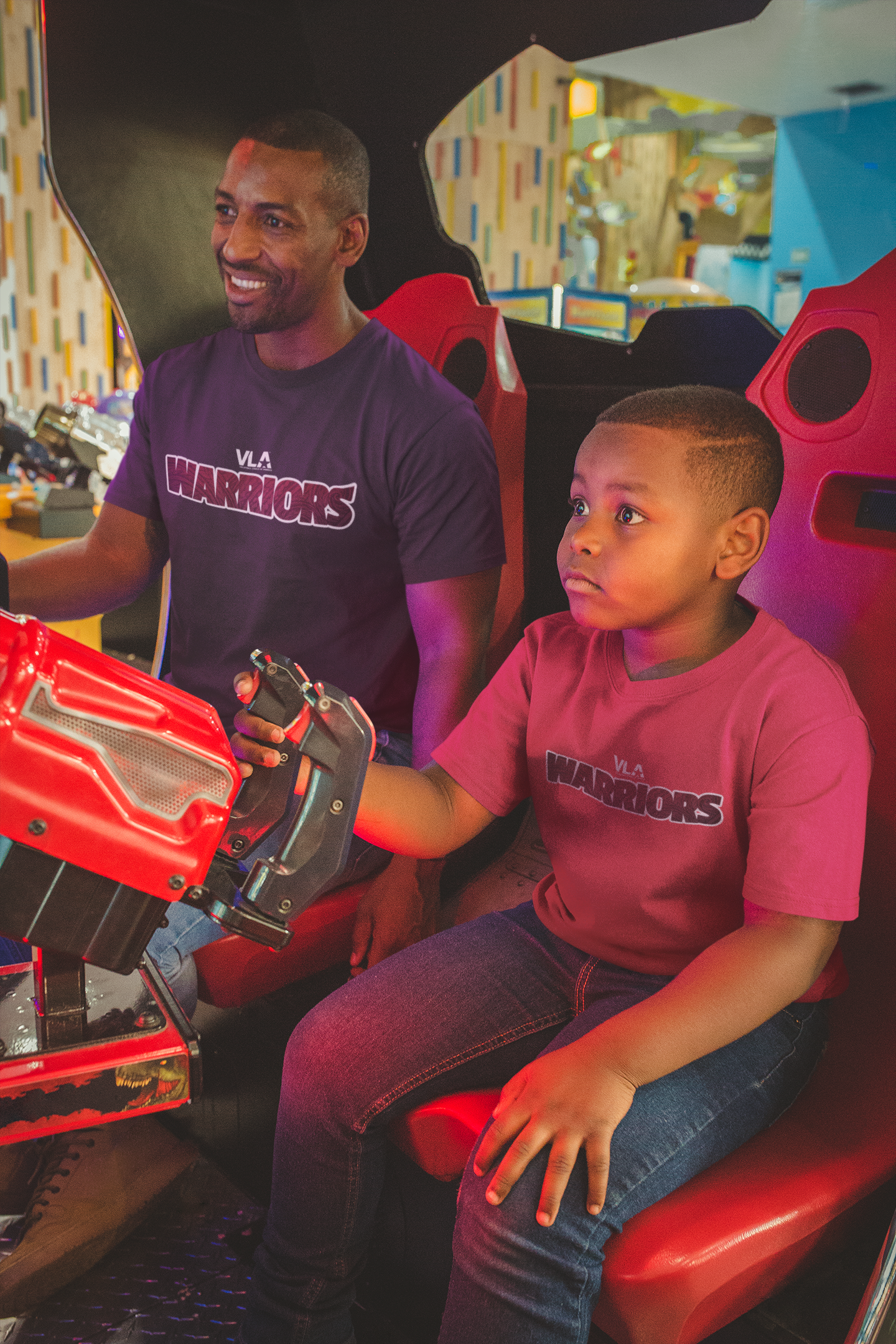 t-shirt-mockup-featuring-a-boy-playing-with-his-father-at-the-arcade-a20545.png