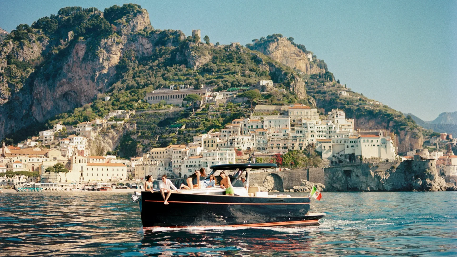 View of Amalfi Coast from the Caruso, A Belmond Hotel with boat on the water
