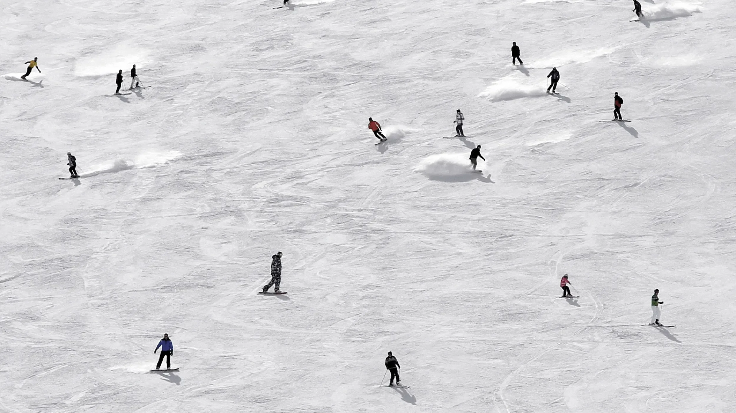 Skiers near the Rosewood Hotel in Corchevel