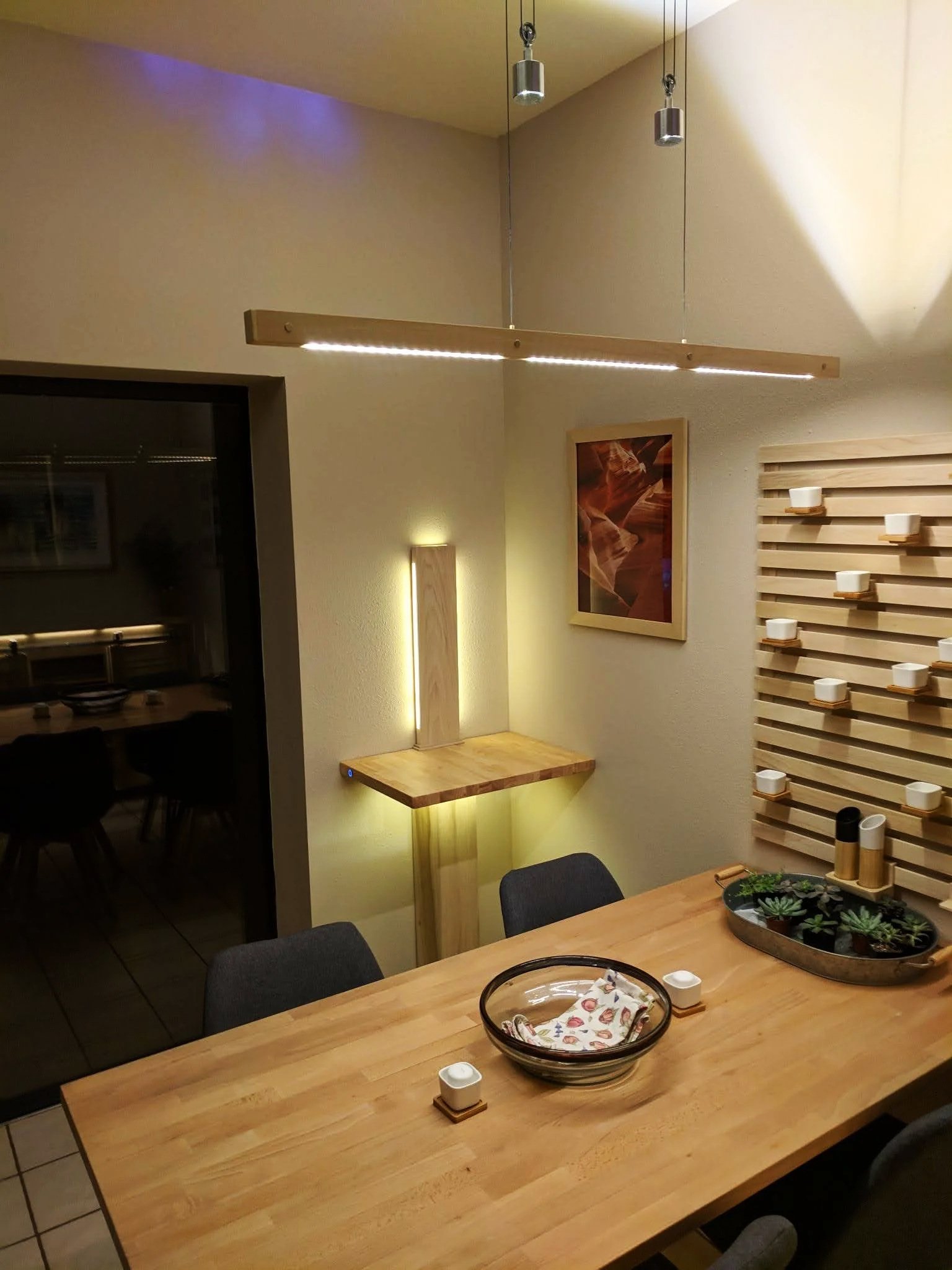 Photography display with custom side table, lamp and breakfast table
