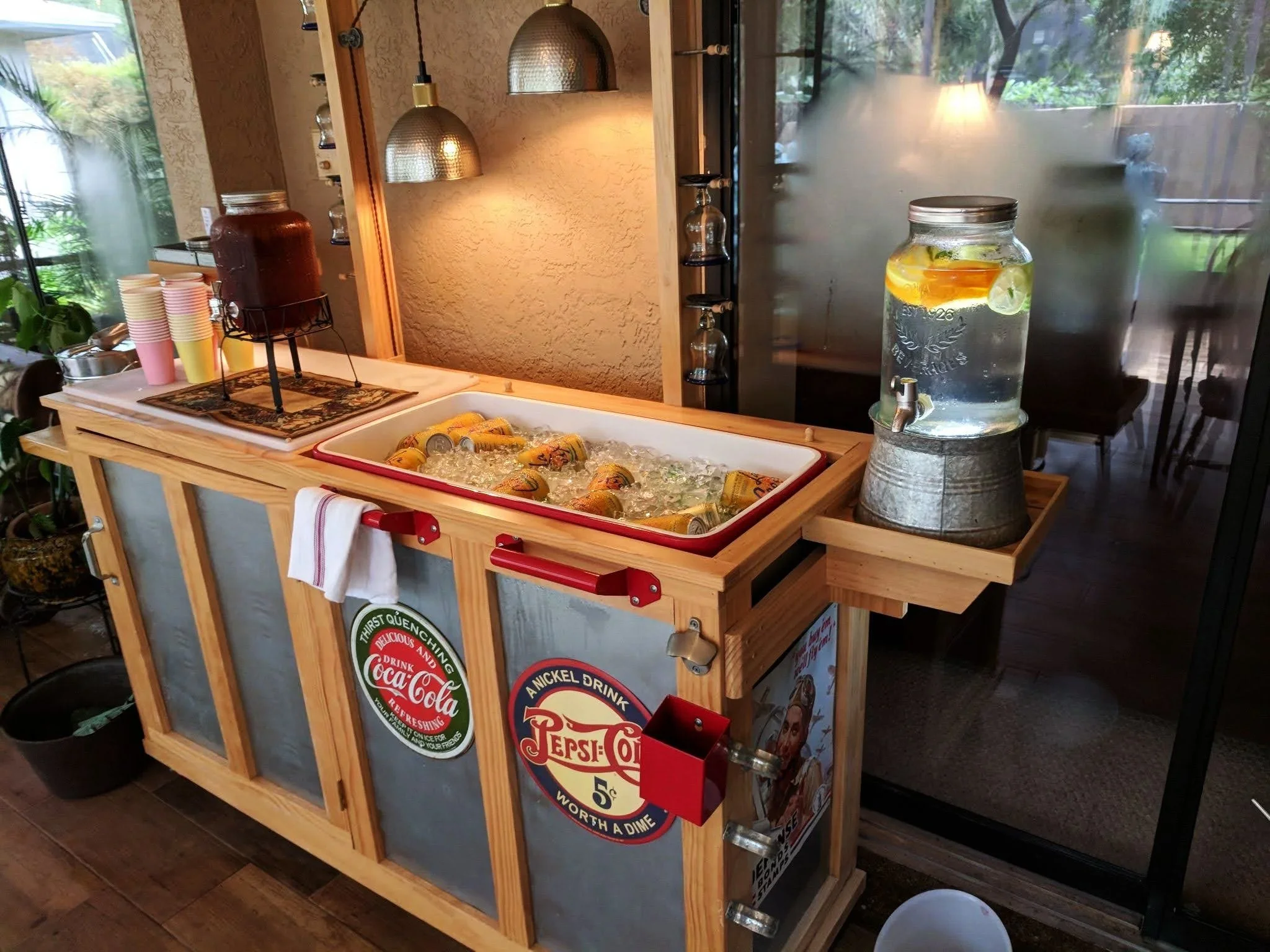 Outdoor bar with cooler and shelf for spa water