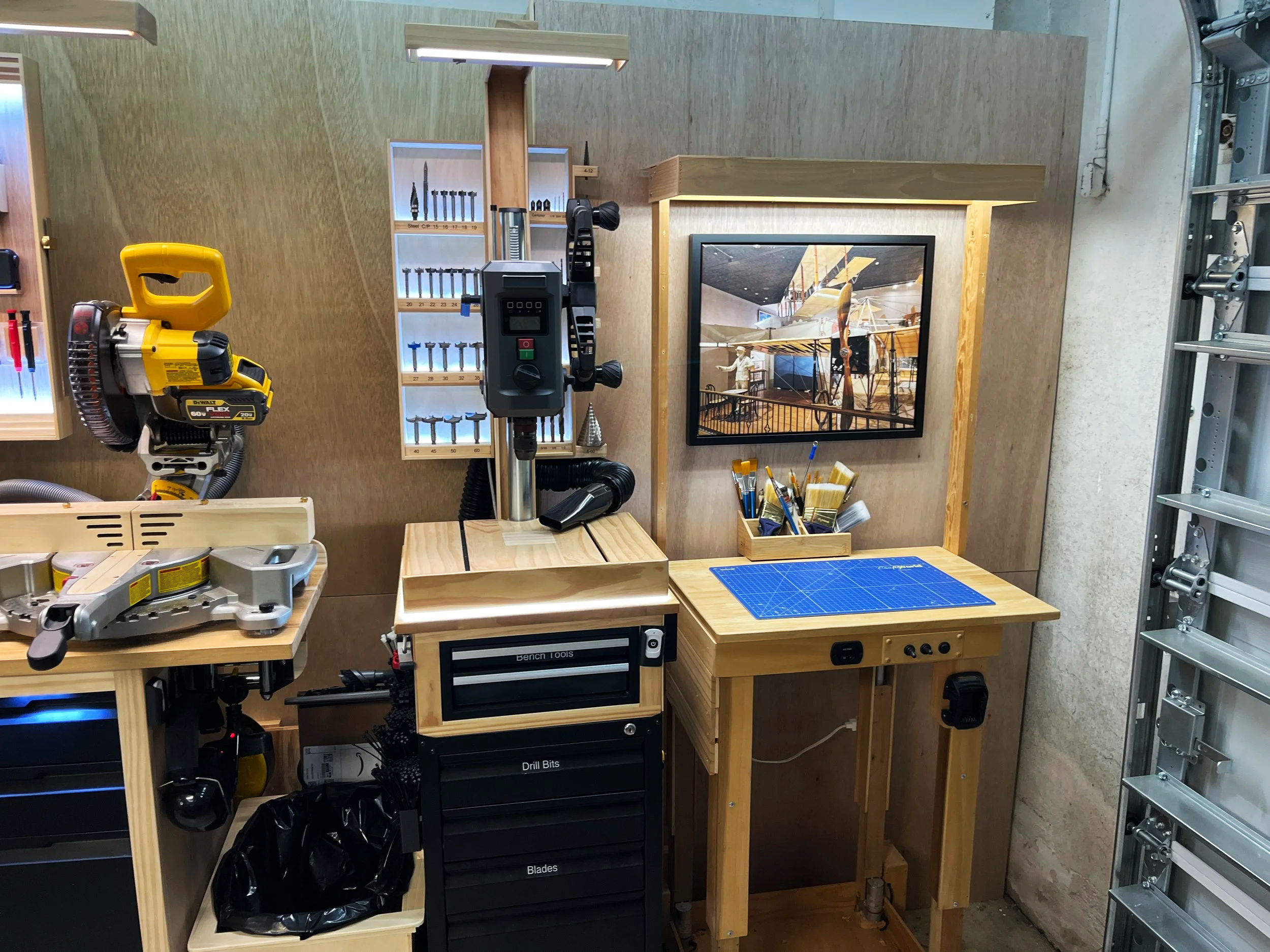 Electronic drill press with table, storage drawers and backlit tool storage