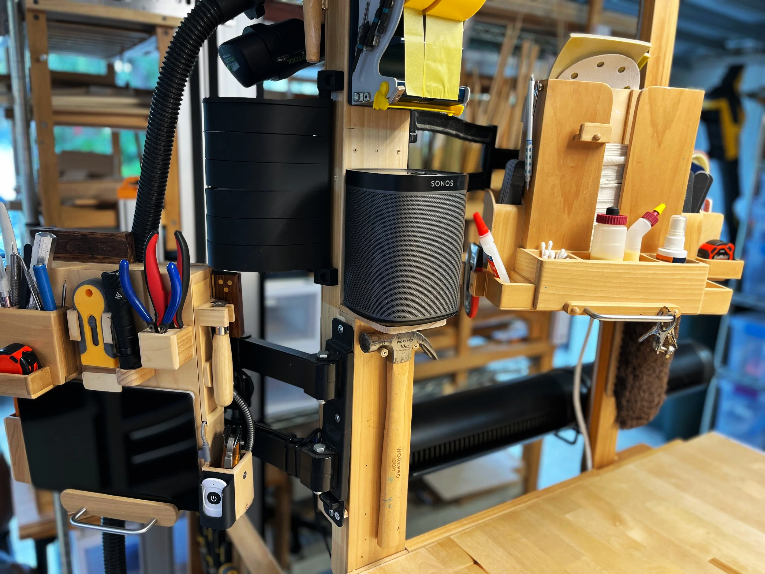 Swing arm tool and supply storage