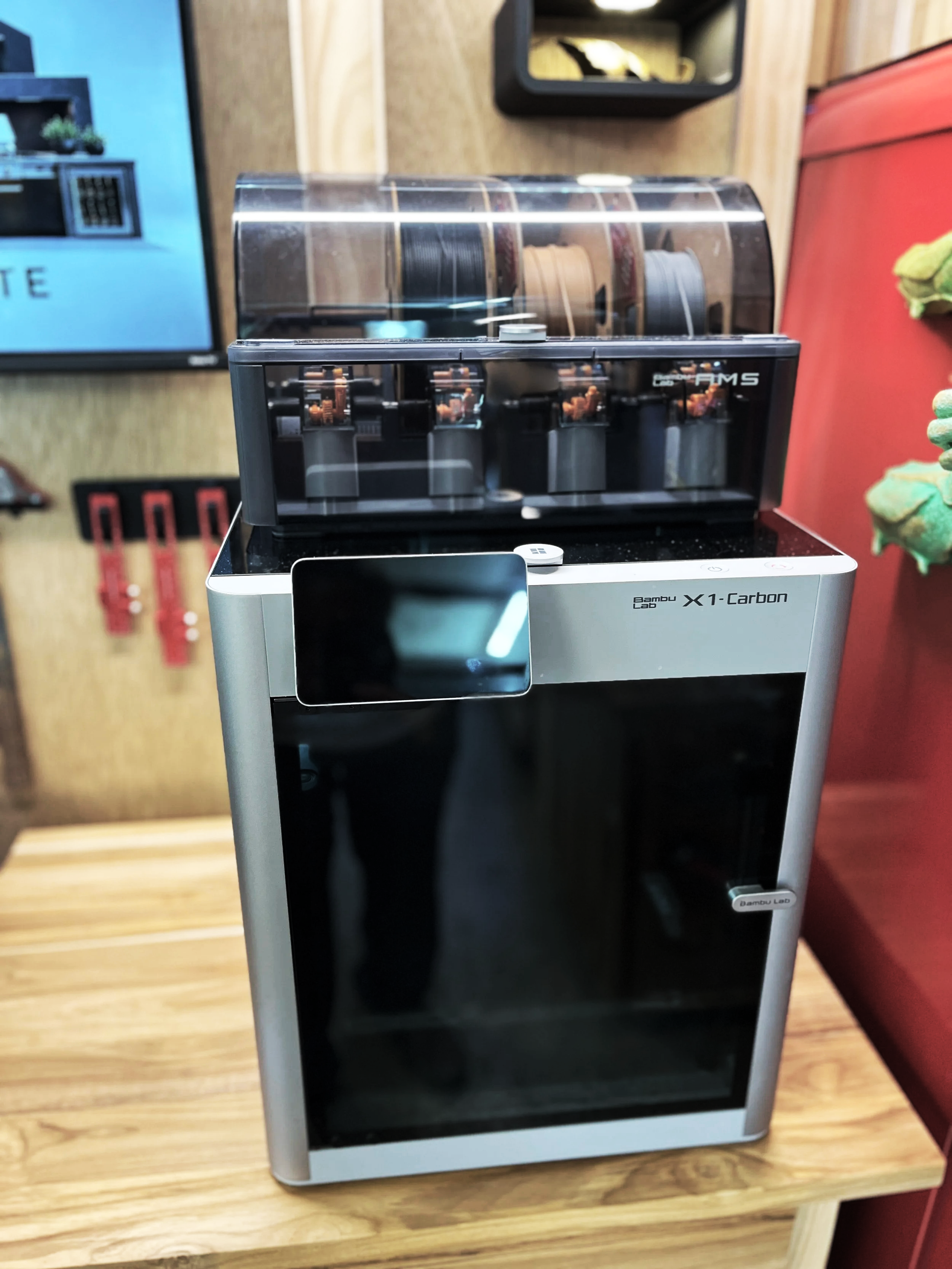 Bambu Lab X1 Carbon 3D printer in a custom woodworking shop