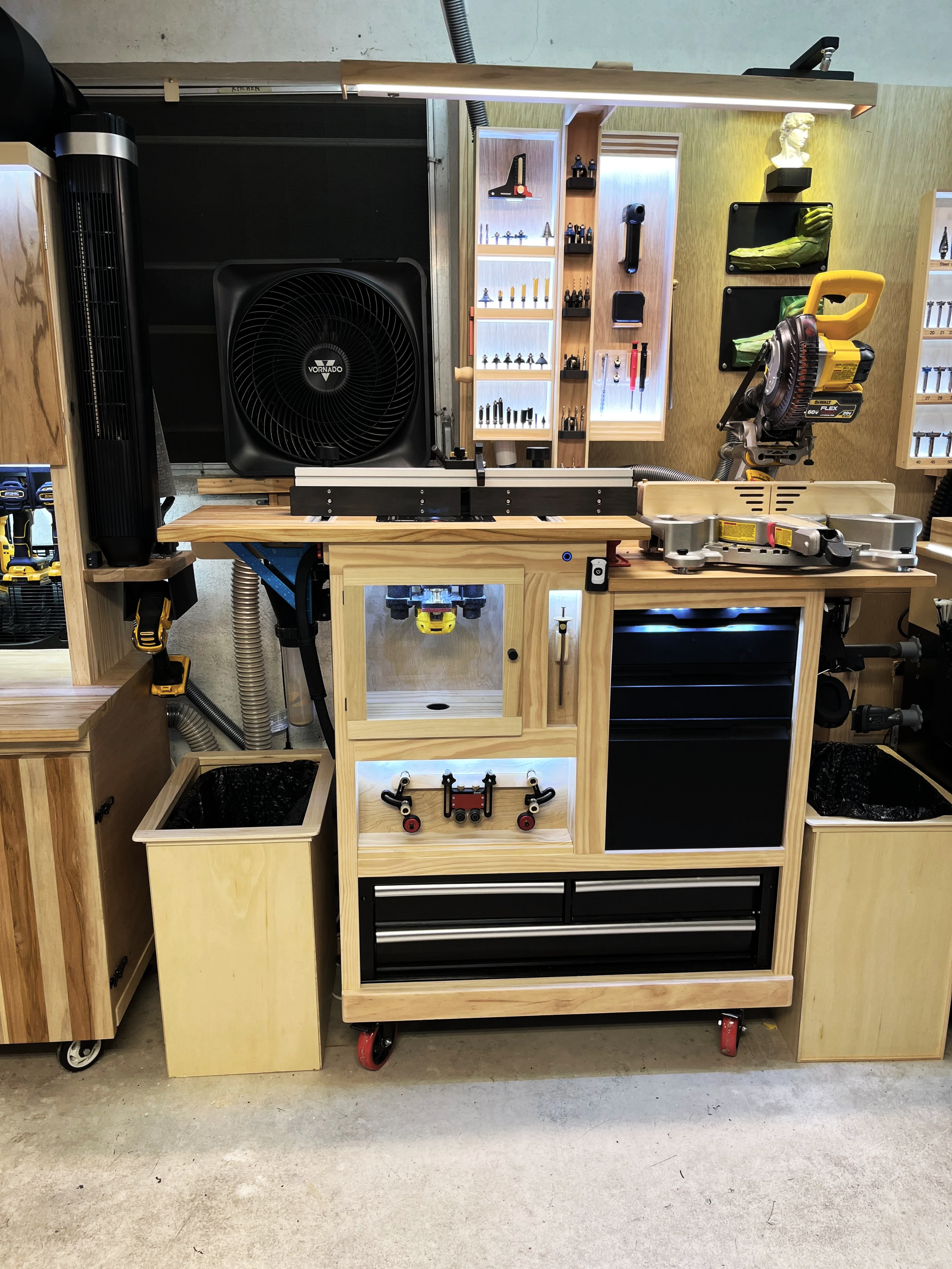 Miter saw station with built in router table and backlit tool storage