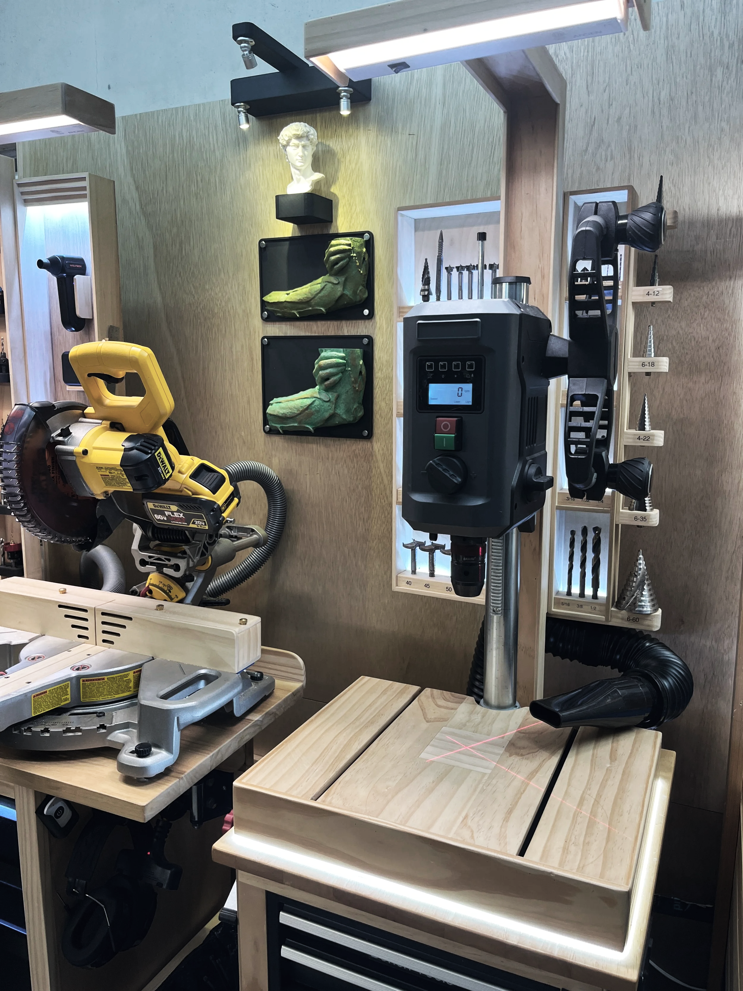 Electronic drill press with table, storage drawers and backlit drill bit storage