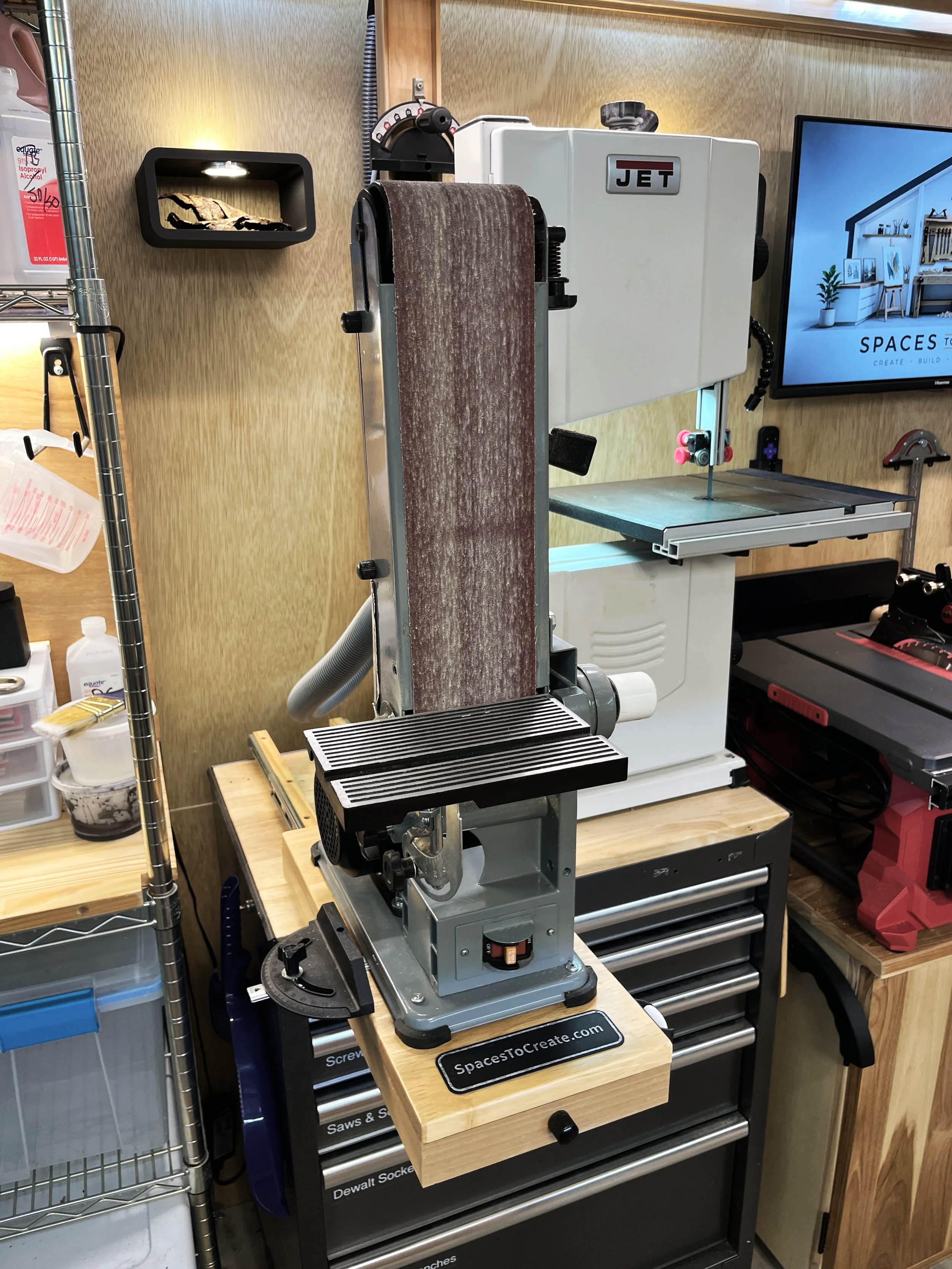 Pull-out belt sander integrated into a custom woodworking workstation
