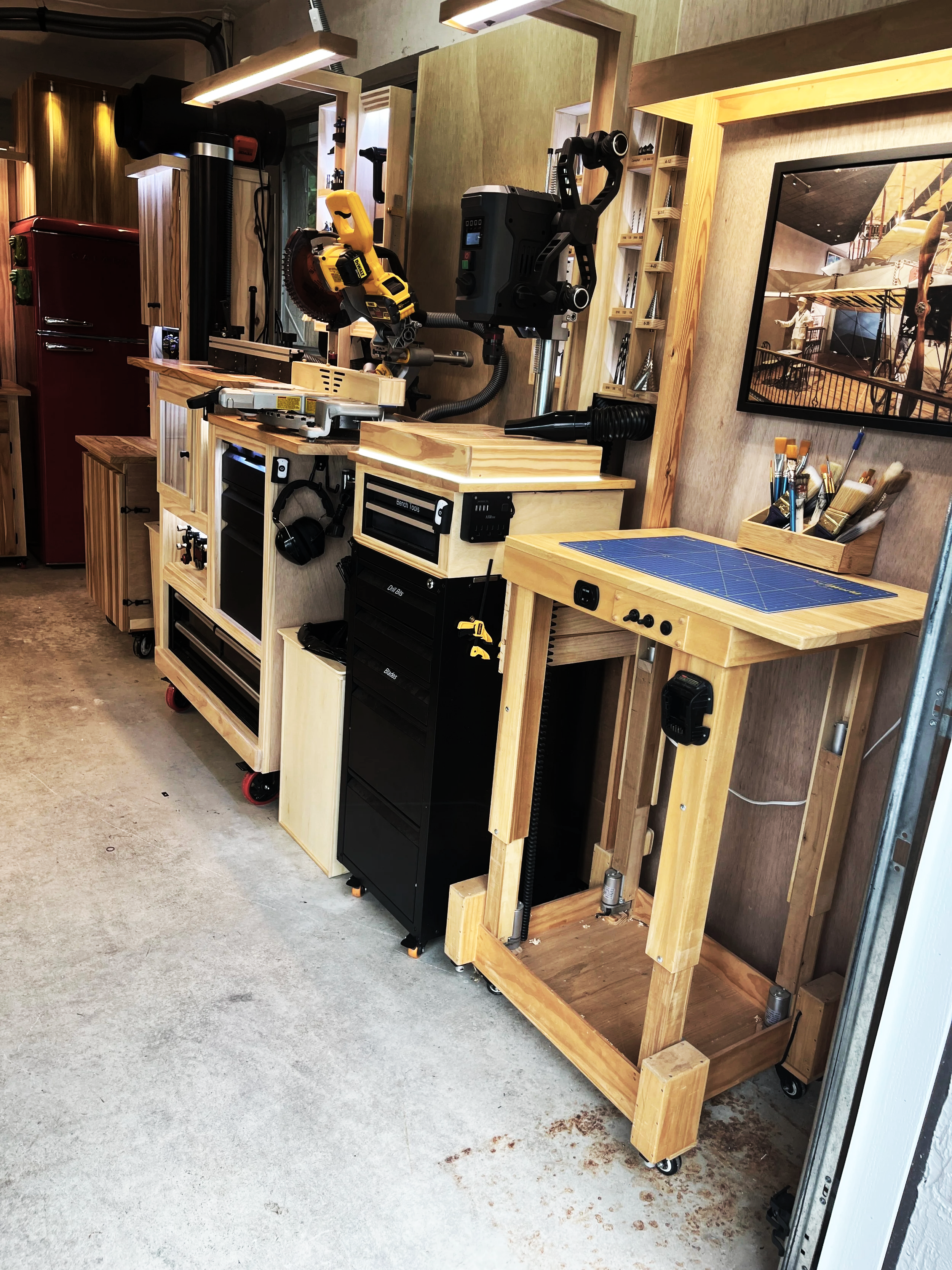 Integrated lighting and dust collection system in a woodworking shop