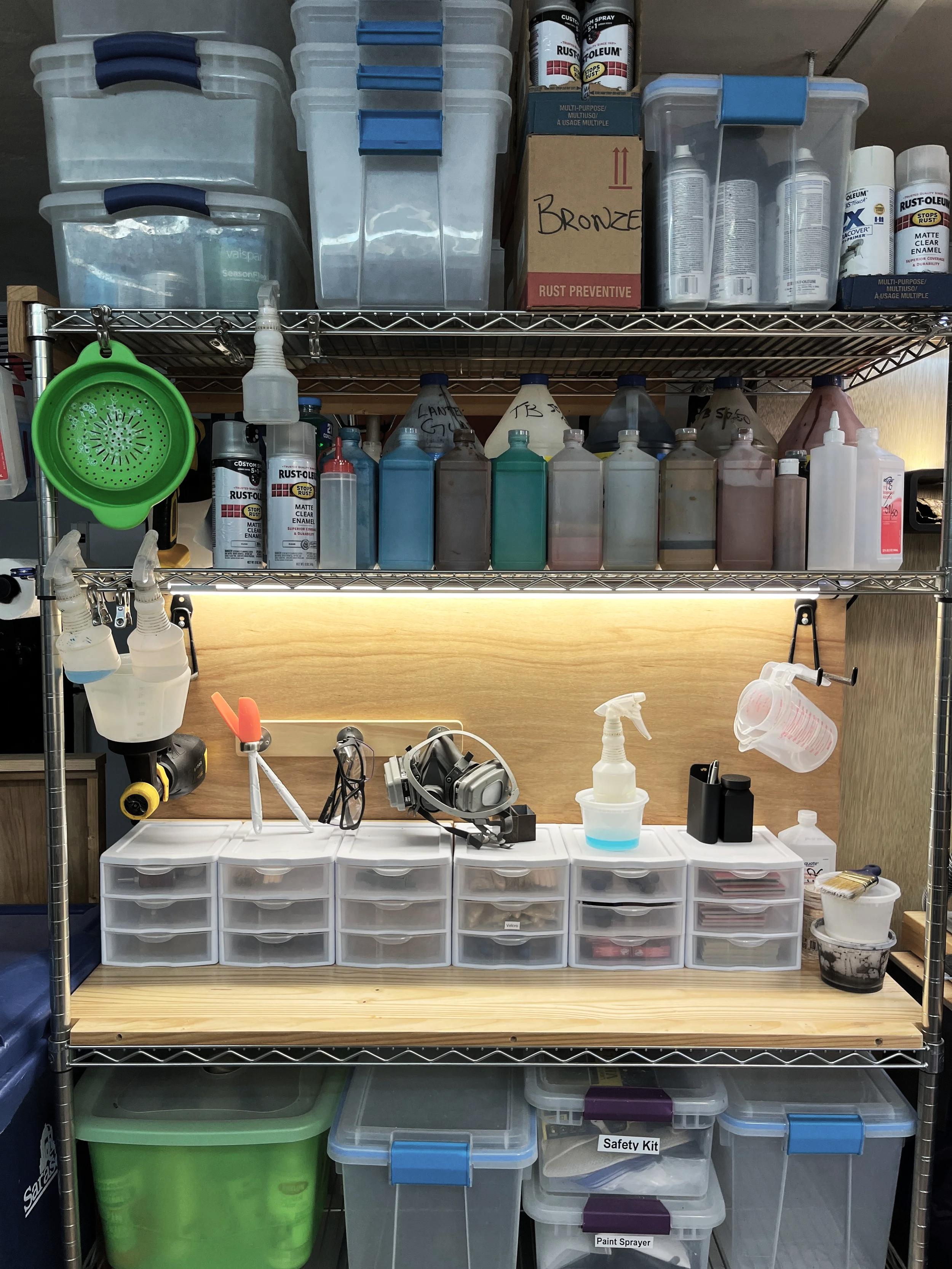 Organized art and woodworking supply storage in a custom workshop