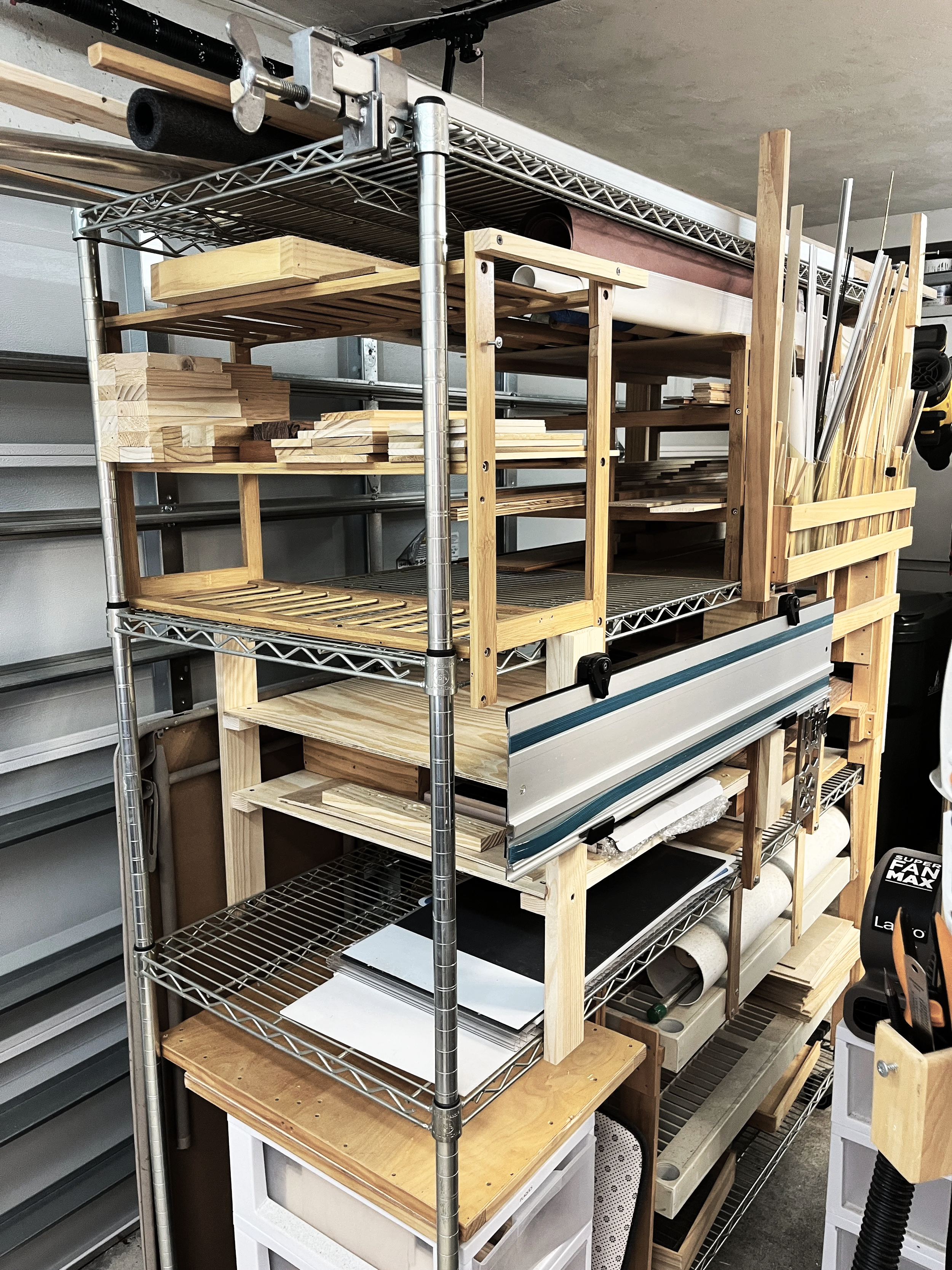 Rolling lumber rack with integrated track saw rail storage