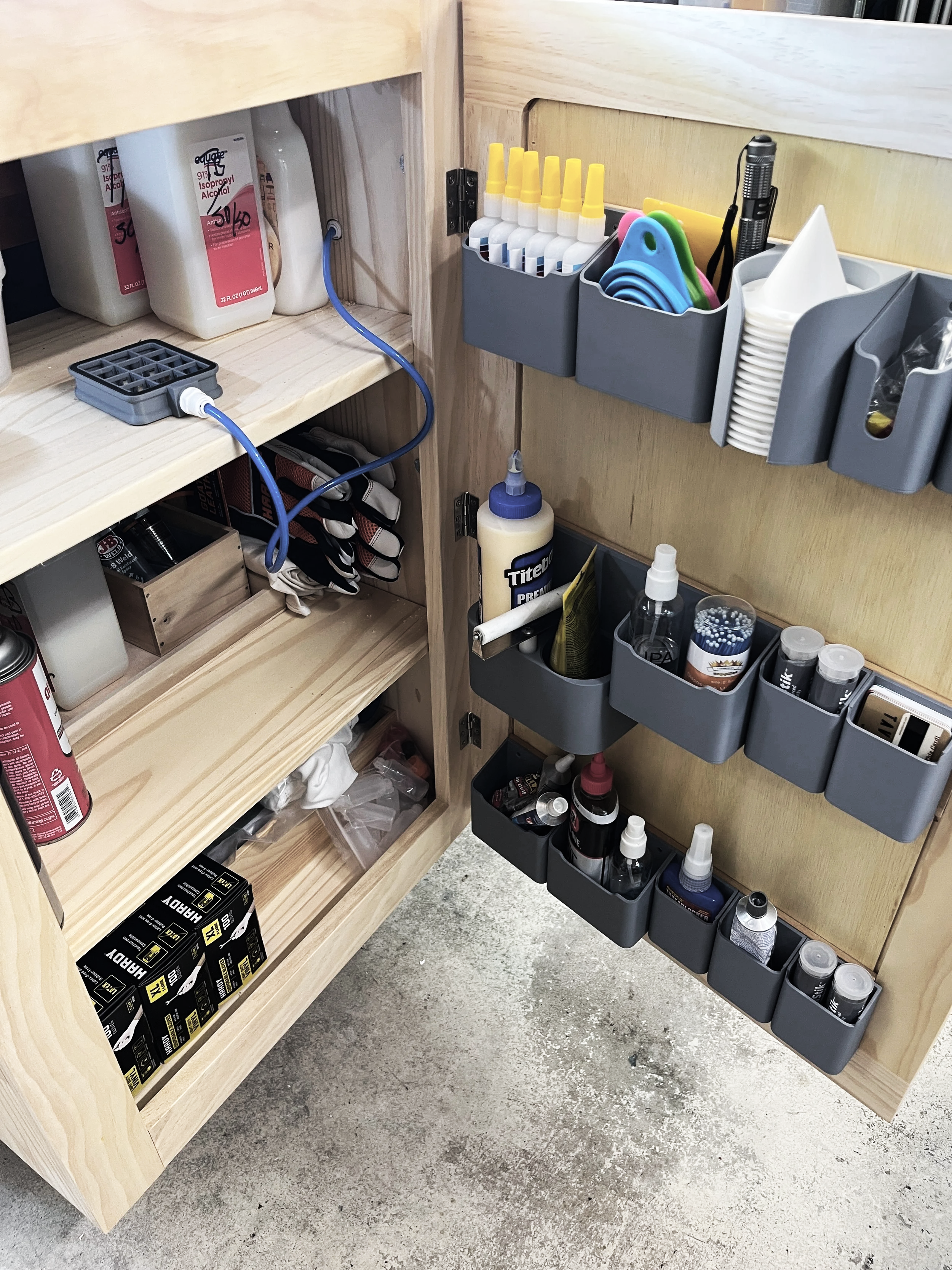 Organized finishing supply storage in a custom woodworking shop