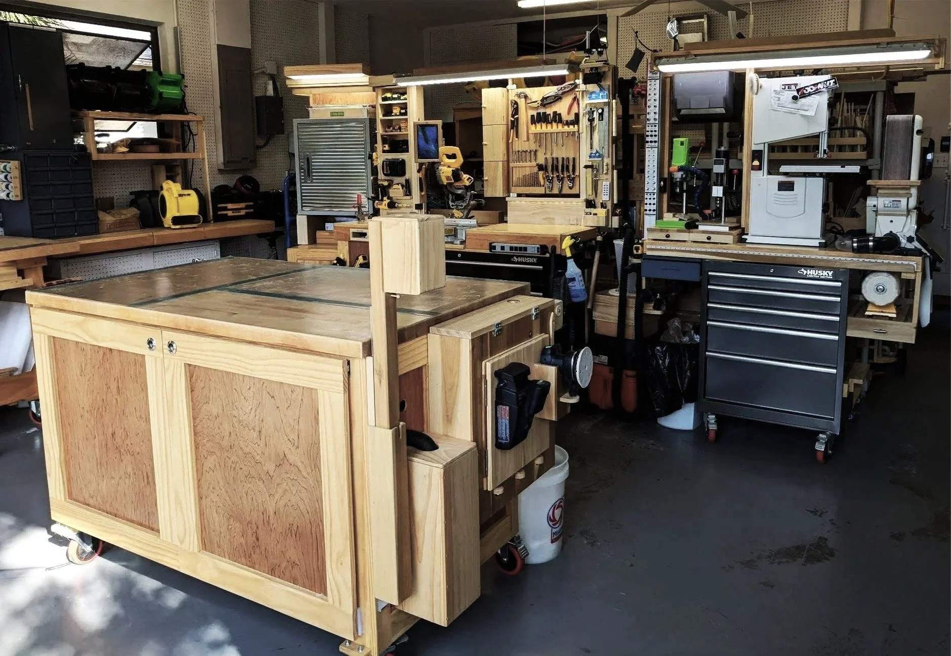 Custom modular woodworking workshop with organized workstations and storage