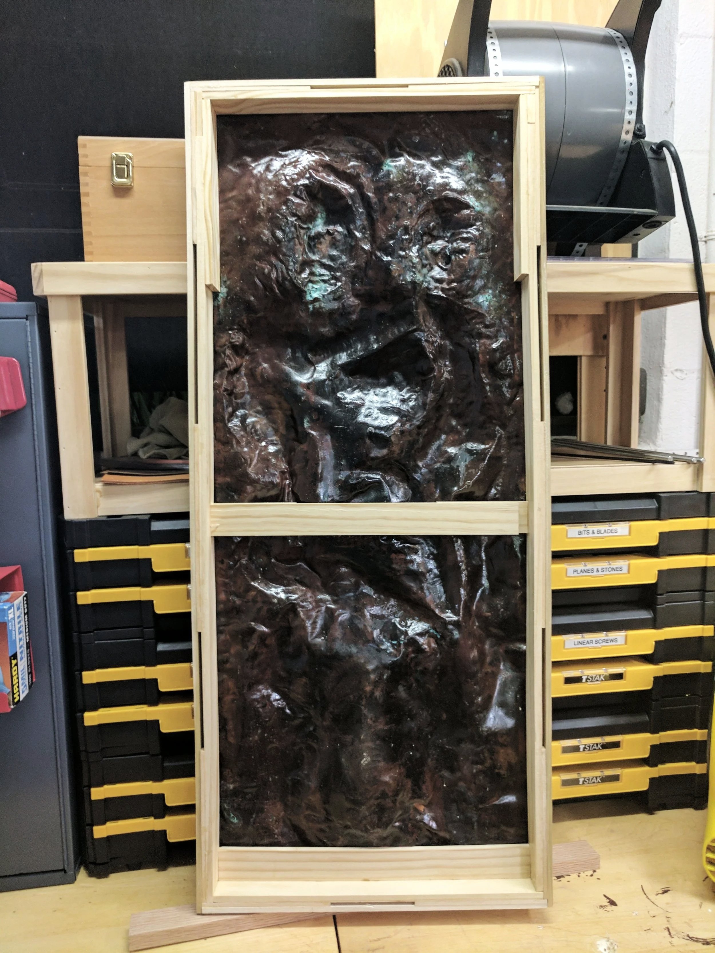 Mother and Child sculpture during restoration and framing