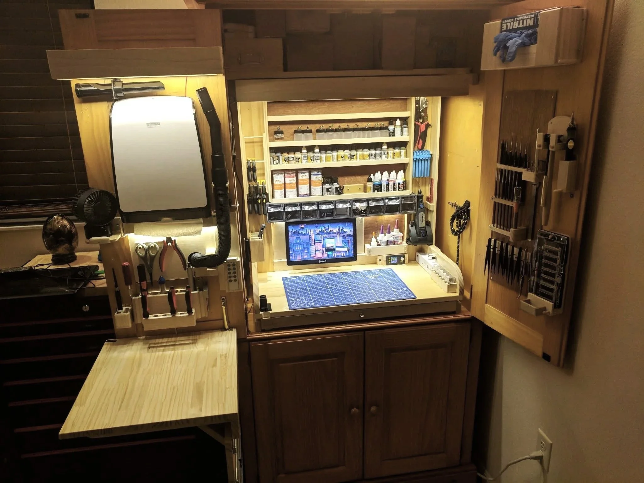 Custom hobby bench built into a storage hutch