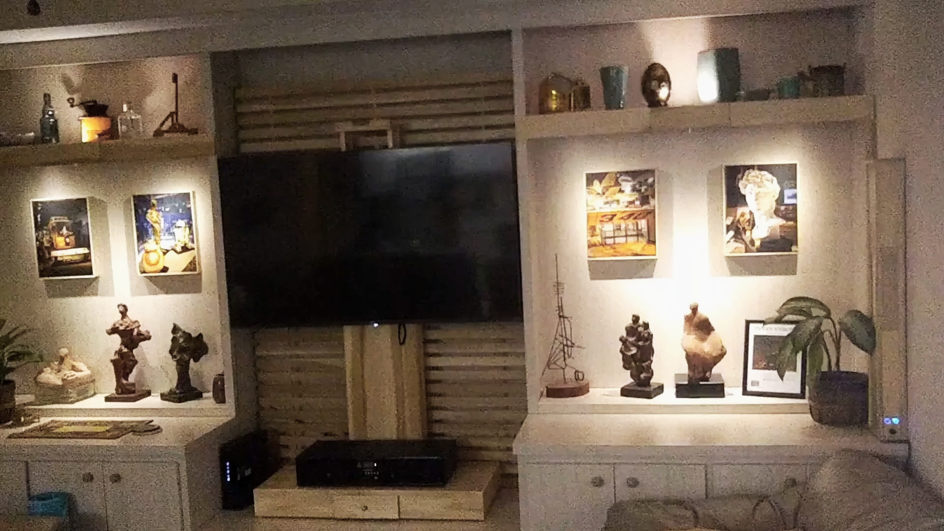 Sculpture displayed in a custom home theater and gallery space