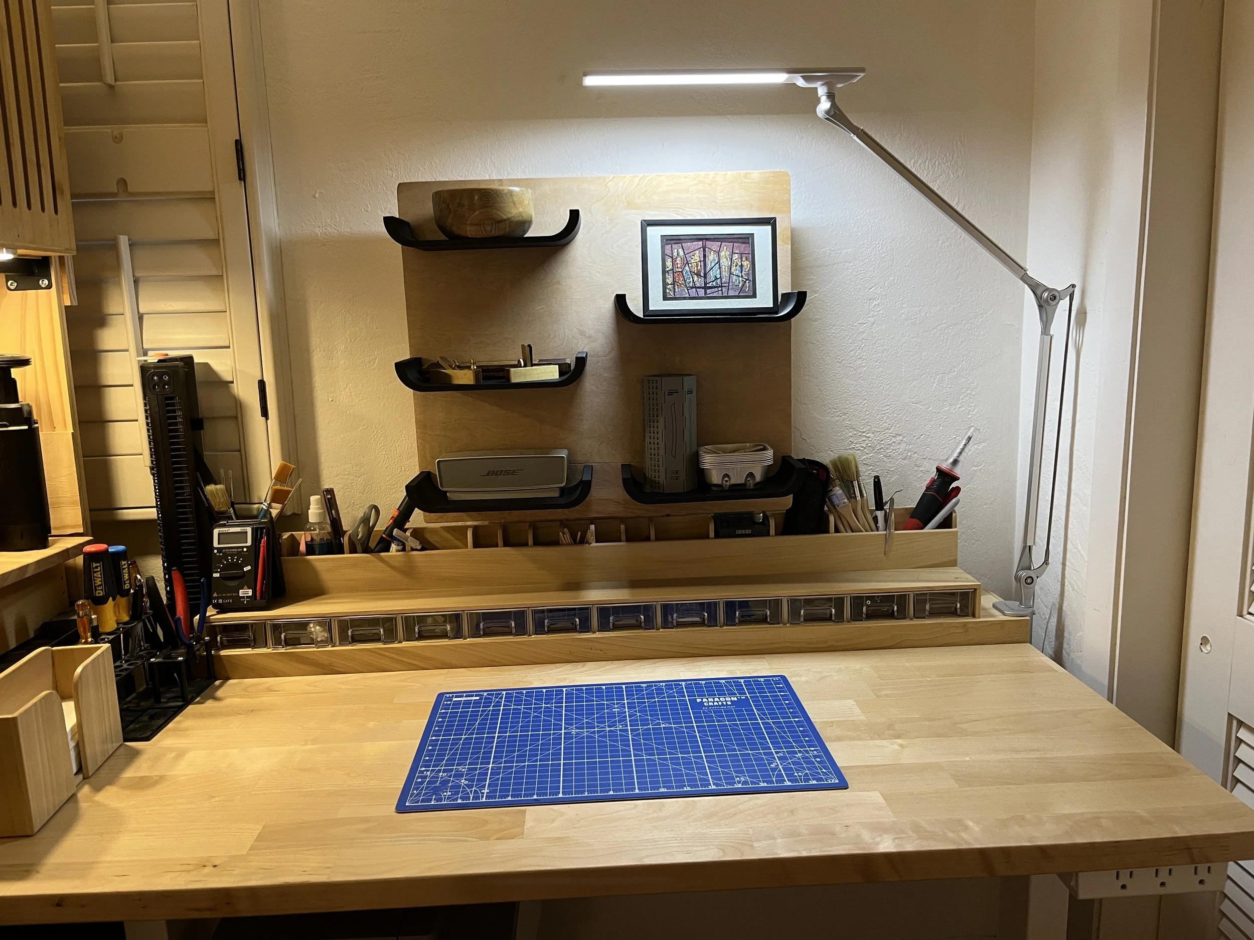 Organized custom craft and hobby workspace with tools and storage