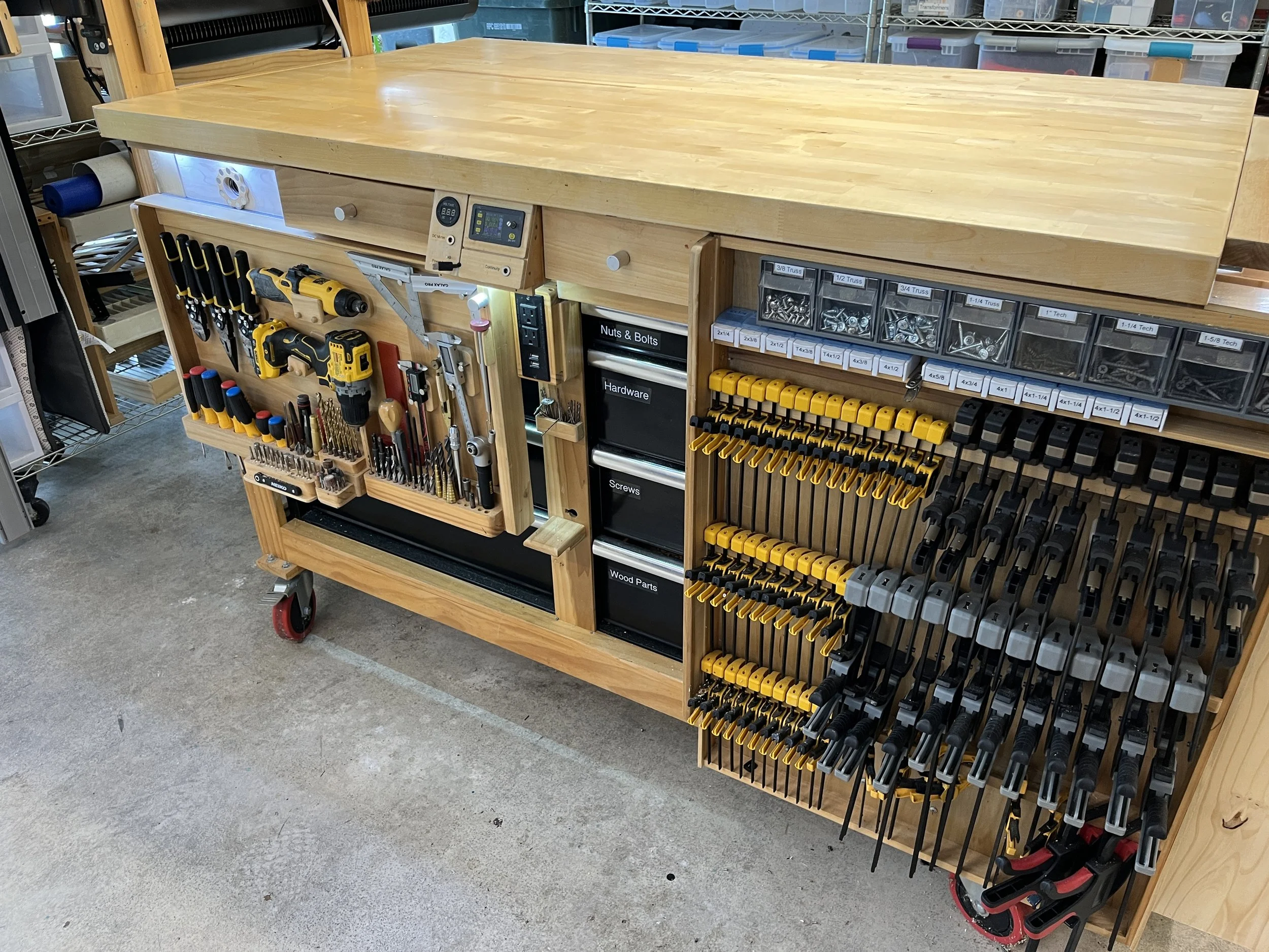 Workbench with slide out tool storage