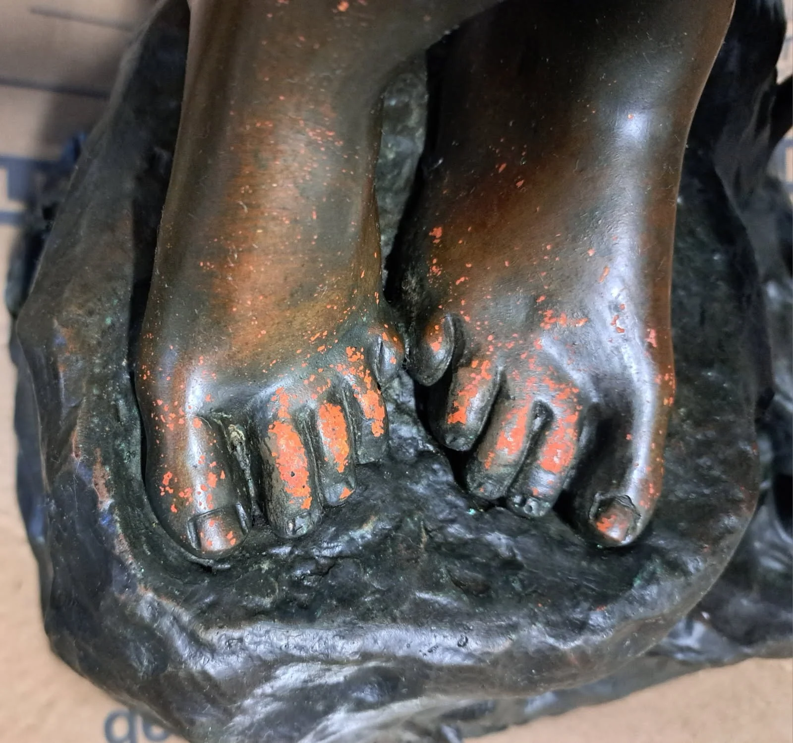 Bronze figure before