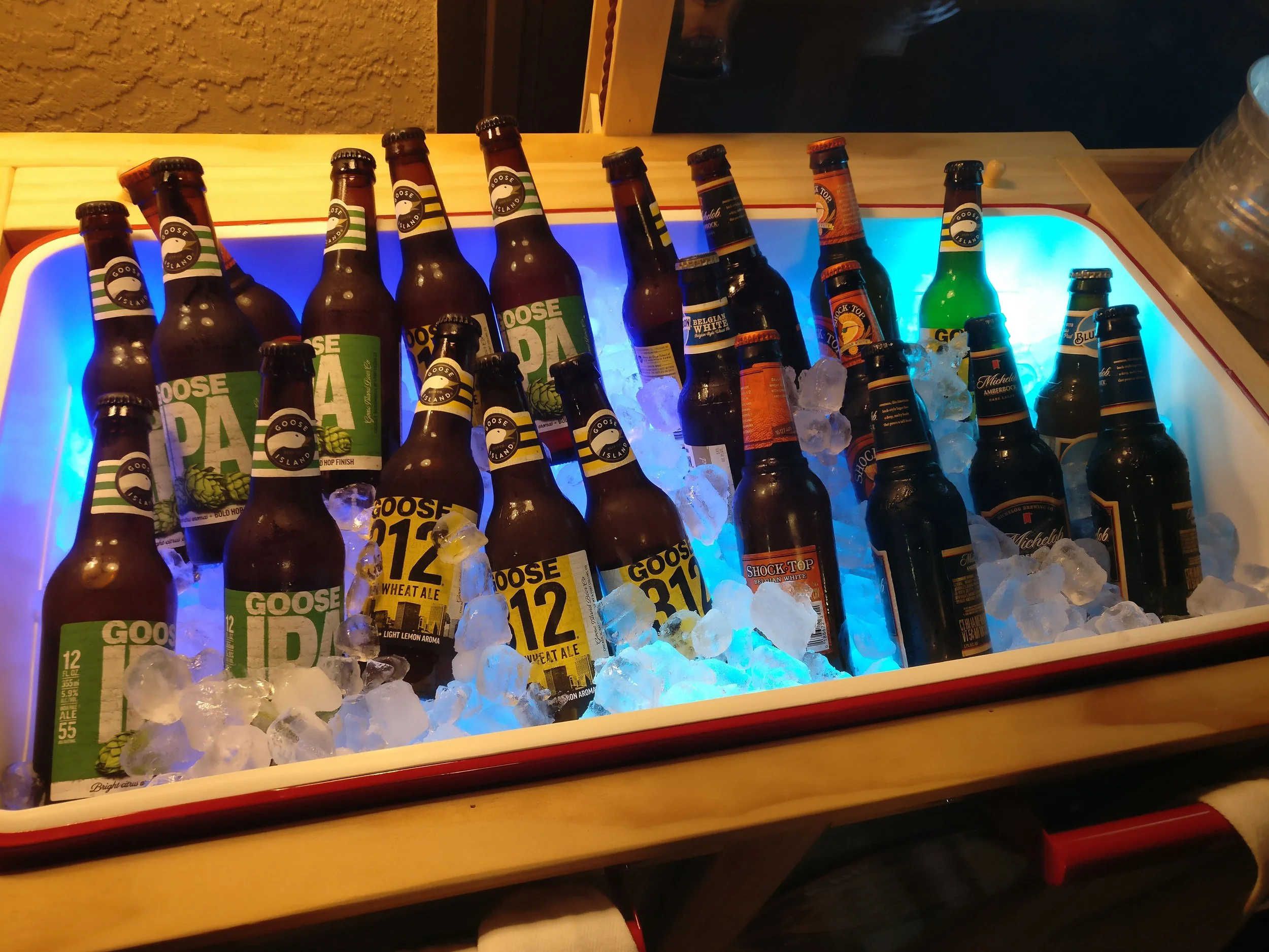 Built-in outdoor beverage cooler with illuminated ice storage