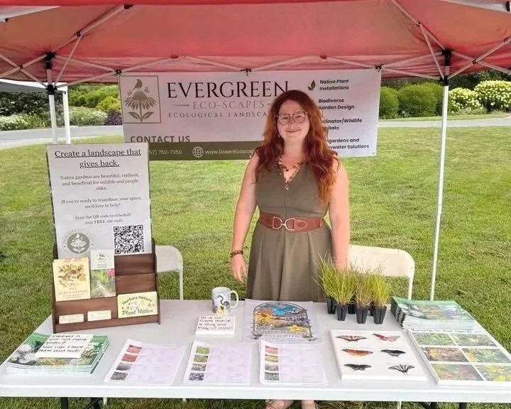 Owner of Evergreen Eco-Scapes in Chesapeake, VA at a community event in a booth.