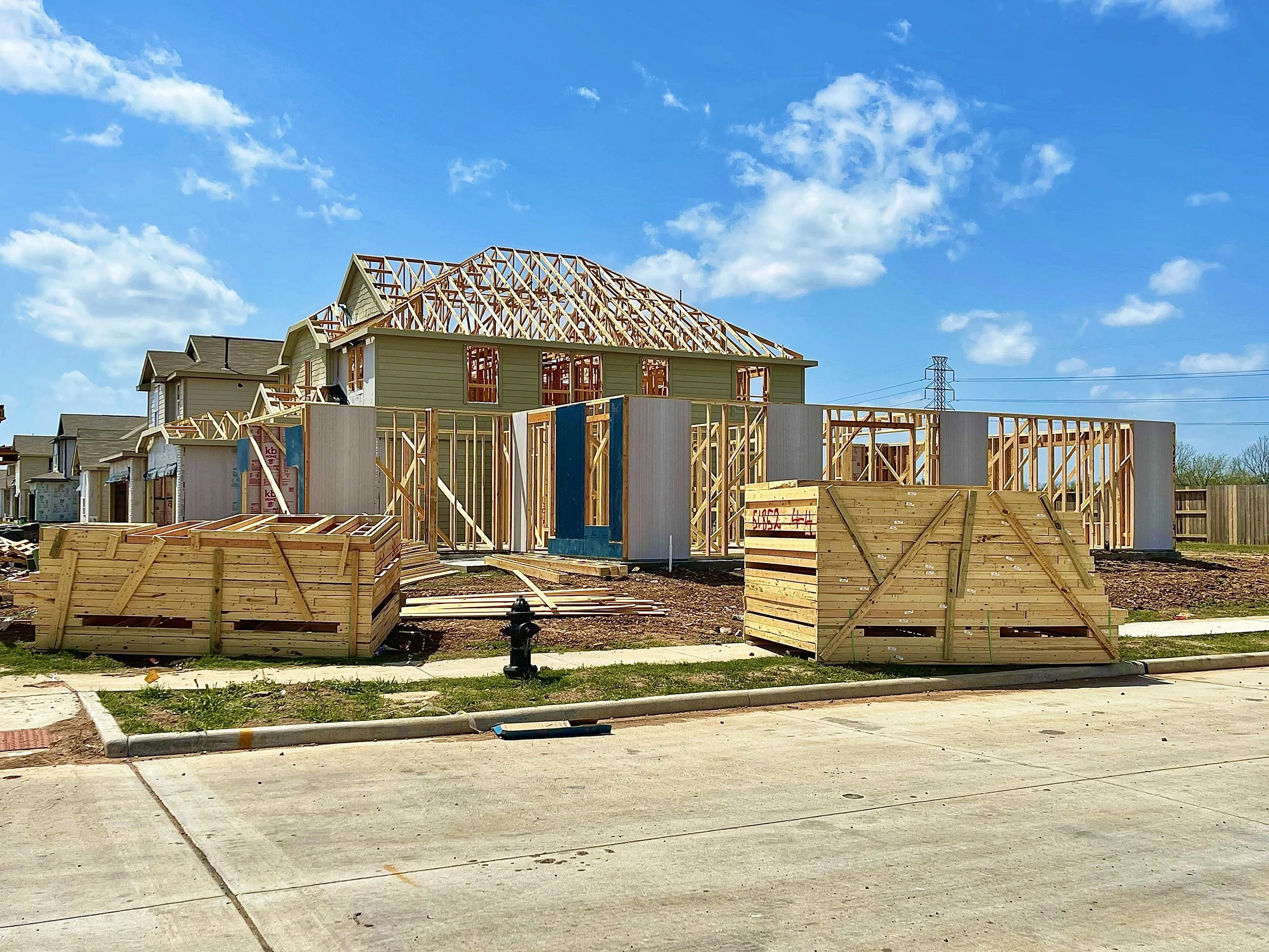 new-home-construction-on-sunny-day-in-suburbs-2026-03-16-00-37-56-utc.jpeg