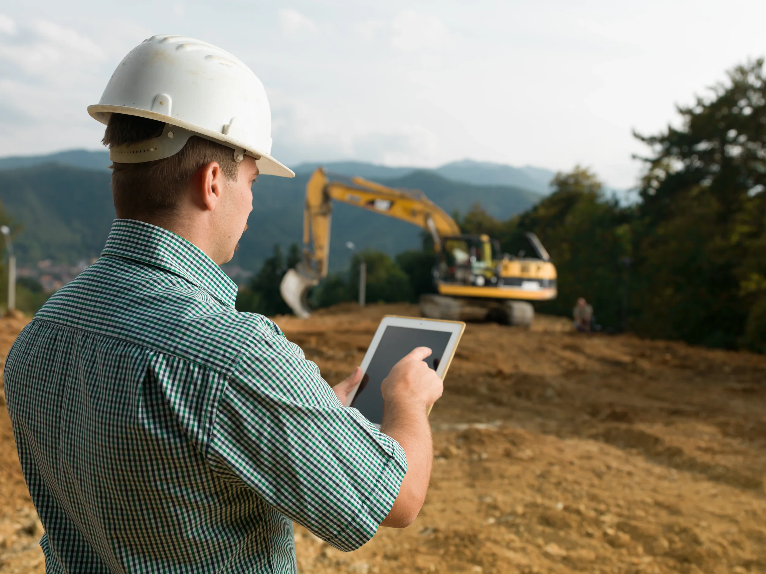 construction-worker-using-tablet-at-construction-s-2026-03-09-23-09-43-utc.webp